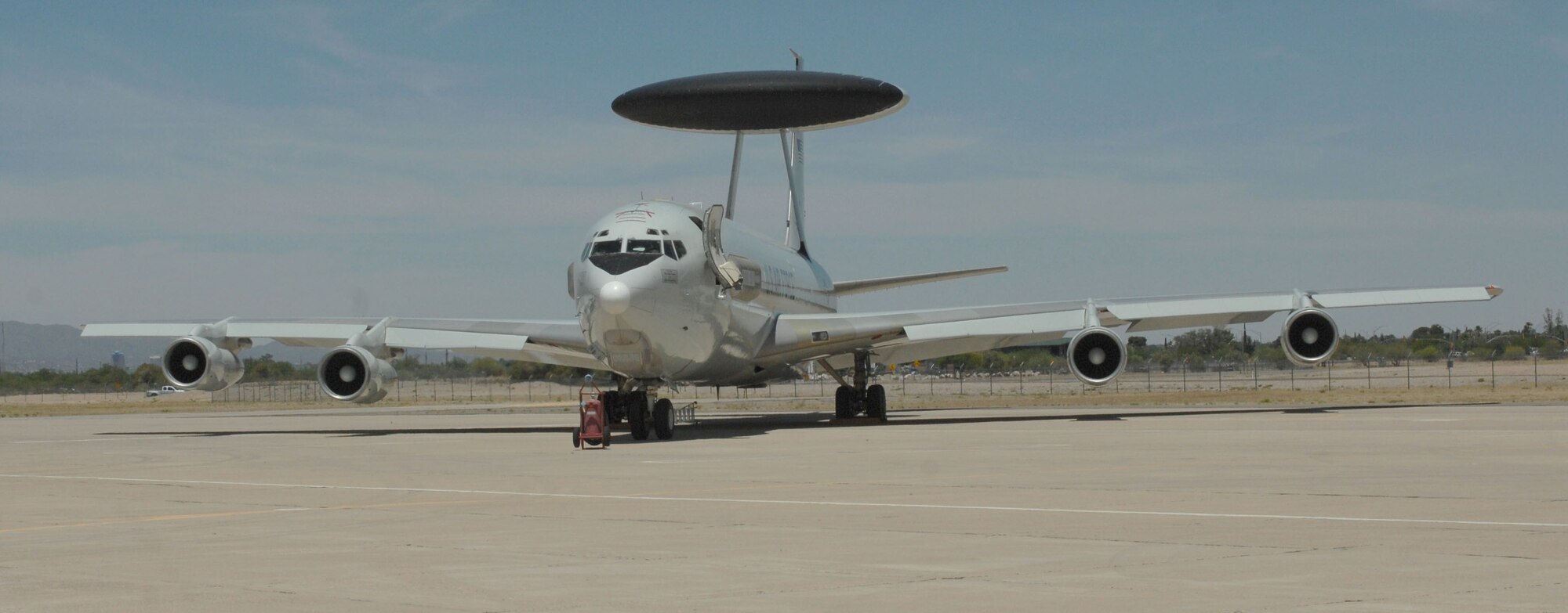 An E-3 Sentry sits on a ramp at Davis-Monthan AFB, Ariz., May 21, 2013. The aircraft was diverted to D-M from Tinker AFB, Okla. because a tornado destroying a town about three miles south of Tinker. (U.S. Air Force photo by Airman 1st Class Betty R. Chevalier/released)