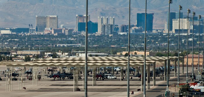 F-15 Eagles, assigned to Nellis Air Force Base, sit dormant under sun shades on the flightline, May 20, 2013. Under the Air Combat Command stand down effective June 1, all units not directly preparing for combat deployments or involved in operational testing will be grounded through the end of the fiscal year. (U.S. Air Force photo by Airman 1st Class Joshua Kleinholz)
