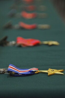 JOINT BASE ELMENDORF-RICHARDSON, Alaska -- One Silver Star Medal and six Bronze Star Medals lay ready here May 18 to go to men of valor from the Alaska Air National Guard's 212 Rescue Squadron. The medals were presented for actions from the 212 Rescue Squadron's deployments in 2011 and 2012. National Guard photo by Staff Sgt. N. Alicia Goldberger.