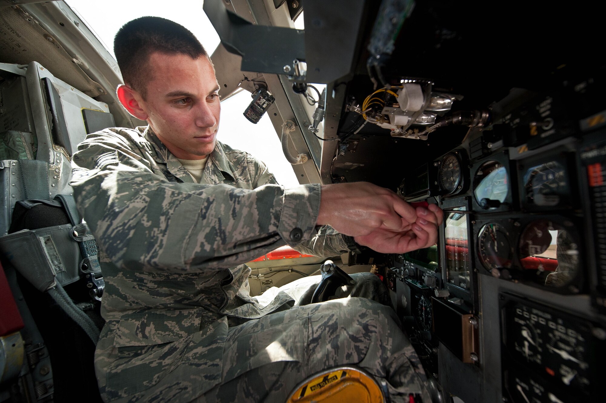 Senior Airman Cody Candrea, 28th Aircraft Maintenance Squadron instrument flight controls technician, adjusts the self contained attitude indicator systems in a B-1 cockpit during routine maintenance at Ellsworth Air Force Base, S.D., May 15, 2013. Instrument flight control technicians specialize in electronics and avionics, and maintain and repair everything from radar and communications systems to flight controls and weapon systems. (U.S. Air Force photo by Airman 1st Class Zachary Hada/Released)