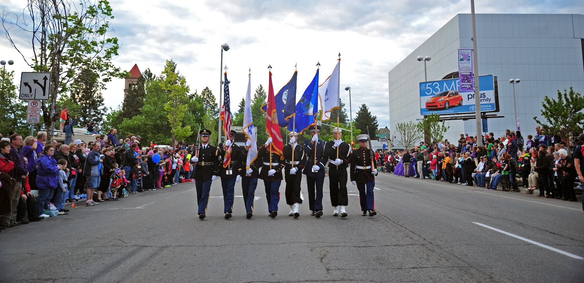 A joint-service honor guard colors team led the Lilac Festival’s Armed Forces Torchlight Parade in Spokane, Wash., May 18, 2013. The parade is considered the nation’s largest Torchlight Parade on Armed Forces Day. (U.S. Air Force photo by Senior Airman Taylor Curry)