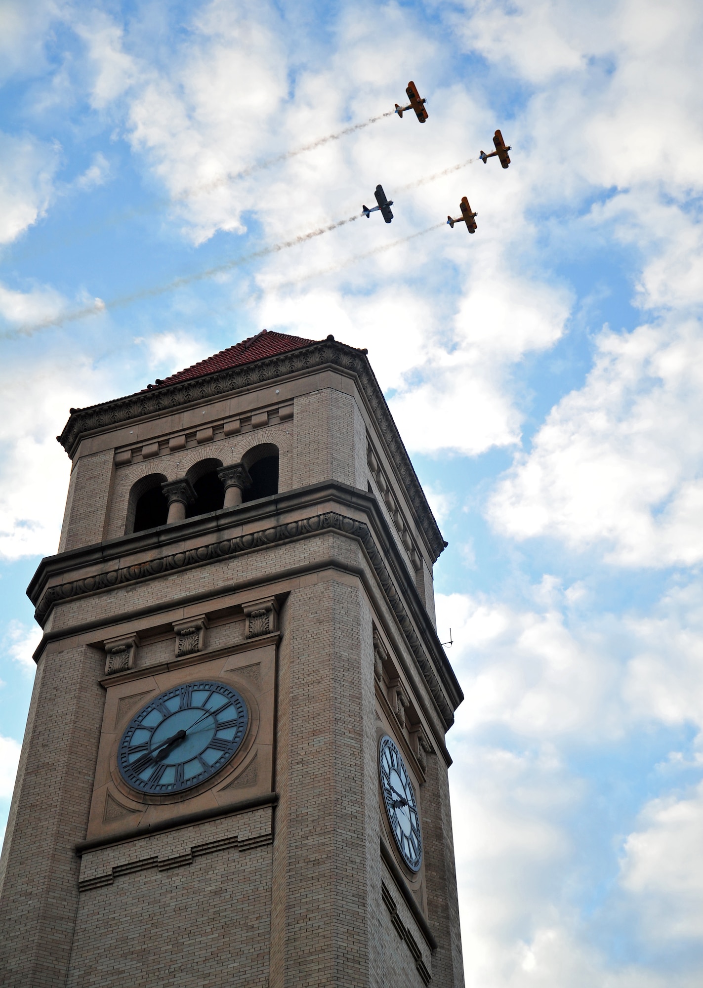 A fly-over was seen above the Spokane clock tower during the Lilac Festival’s Armed Forces Torchlight Parade in Spokane, Wash., May 18, 2013. The parade is considered the nation’s largest Torchlight Parade on Armed Forces Day. (U.S. Air Force photo by Senior Airman Taylor Curry)