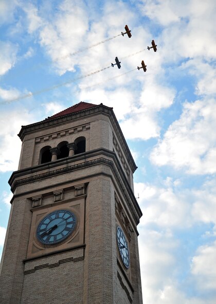 A fly-over was seen above the Spokane clock tower during the Lilac Festival’s Armed Forces Torchlight Parade in Spokane, Wash., May 18, 2013. The parade is considered the nation’s largest Torchlight Parade on Armed Forces Day. (U.S. Air Force photo by Senior Airman Taylor Curry)