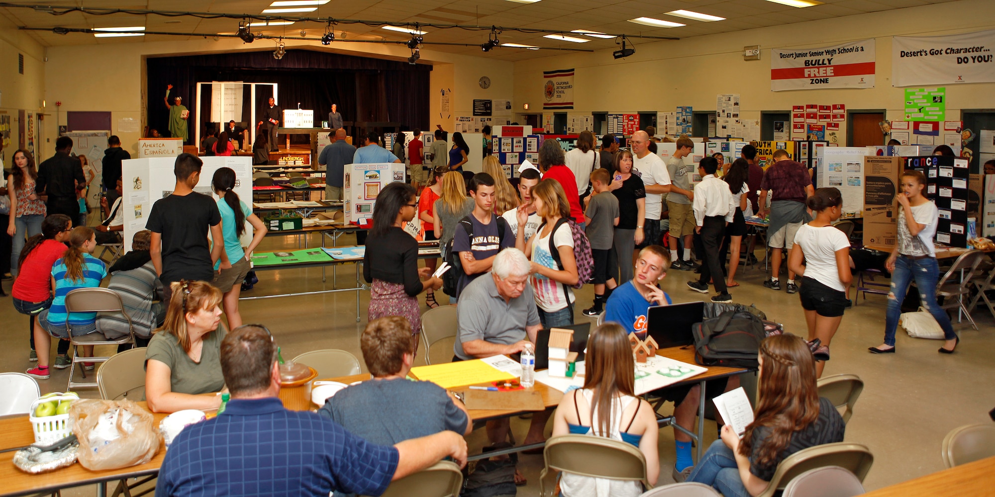 Desert Junior Senior High School was the site of a "Night at the Museum" event hosted by the students and faculty of DJSHS May 20, 2013. The event was an end-of- year, school-wide project where students transformed the halls of the high school, along with the school cafeteria, into static displays, living statues and and interactive history exhibits. (U.S. Air Force photo by Jet Fabara)
