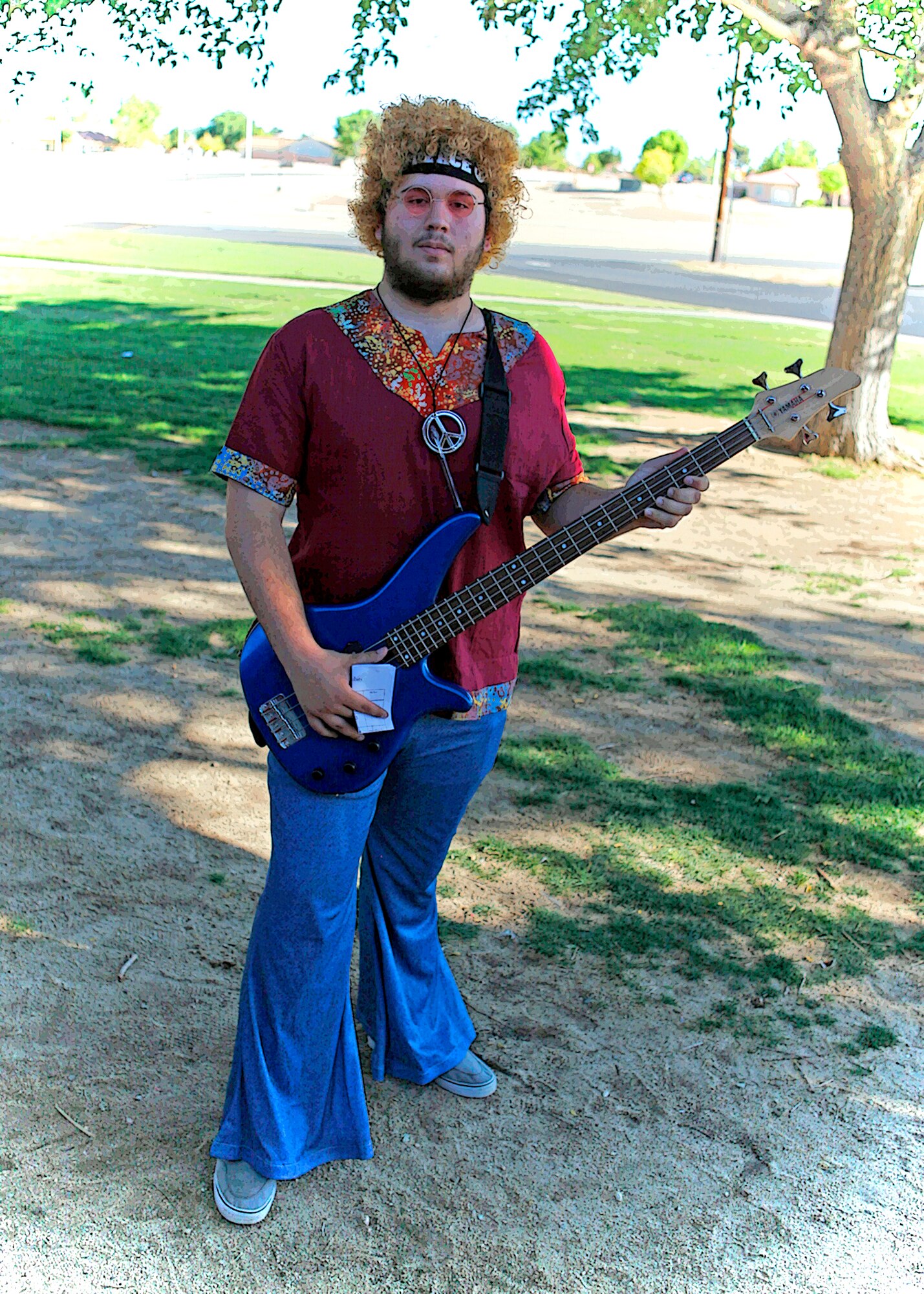 Graphically enhanced photo of Christopher Terry, Desert High School junior, who was re-enacting a 1960 rock musician during a "Night at the Museum" event hosted by the students and faculty of Desert Junior Senoir High School May 20, 2013. The event was an end-of-year, school-wide project where students transformed the halls of the high school into static displays, living statues and and interactive history exhibits. (U.S. Air Force graphic by Jet Fabara)