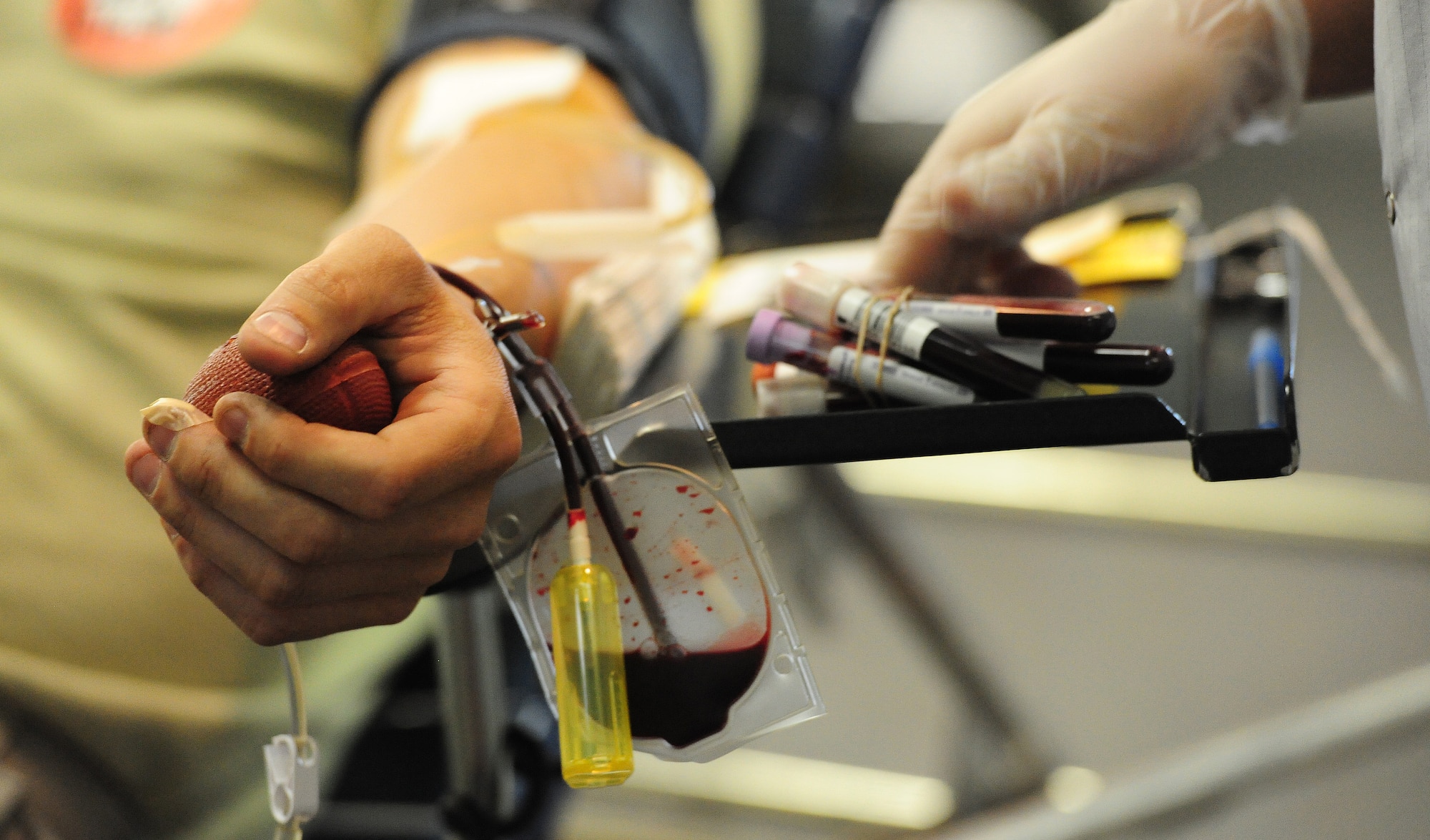 A volunteer donates a pint of blood during a blood drive sponsored by the American Red Cross at Whiteman Air Force Base, Mo., May 16, 2013. Each year the American Red Cross processes more than 6.5 million units of blood from approximately 4 million donors and distributes them to various hospitals across the nation for blood transfusions and research. (U.S. Air Force photo by Staff Sgt. Nick Wilson/Released)