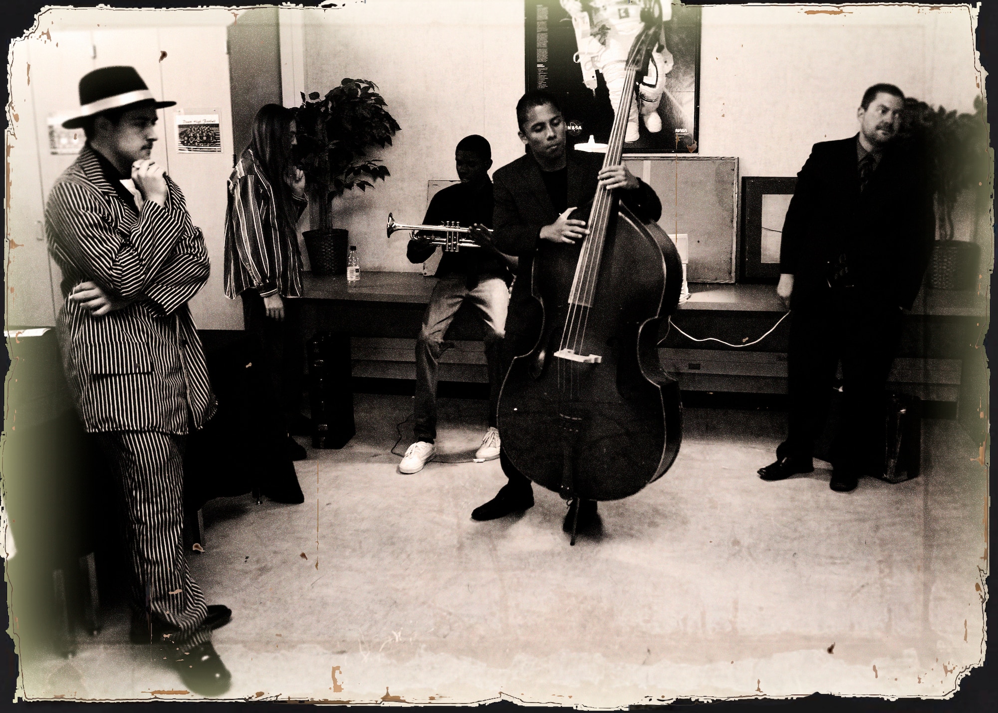 Graphically enhanced photo to replicate the 1920s during a "Night at the Museum" event hosted by the students and faculty of Desert Junior Senoir High School May 20, 2013. The event was an end of year, school-wide project where students transformed the halls of the high school into static displays, living statues and and interactive history exhibits. (U.S. Air Force graphic by Jet Fabara)