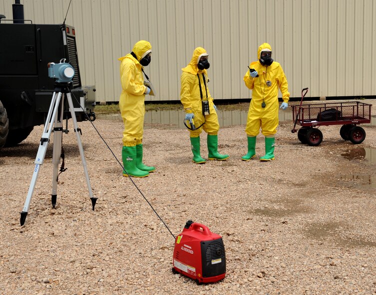 Airmen from the 2nd Aerospace Medicine Squadron bioenvironmental surveys an area for contamination levels during a joint exercise on Barksdale Air Force Base, La., May 17, 2013. The exercise gave emergency personnel hands on experience on how to handle aircraft accidents with strategic weapons on board. (U.S. Air Force photo/Airman 1st Class Benjamin Gonsier)