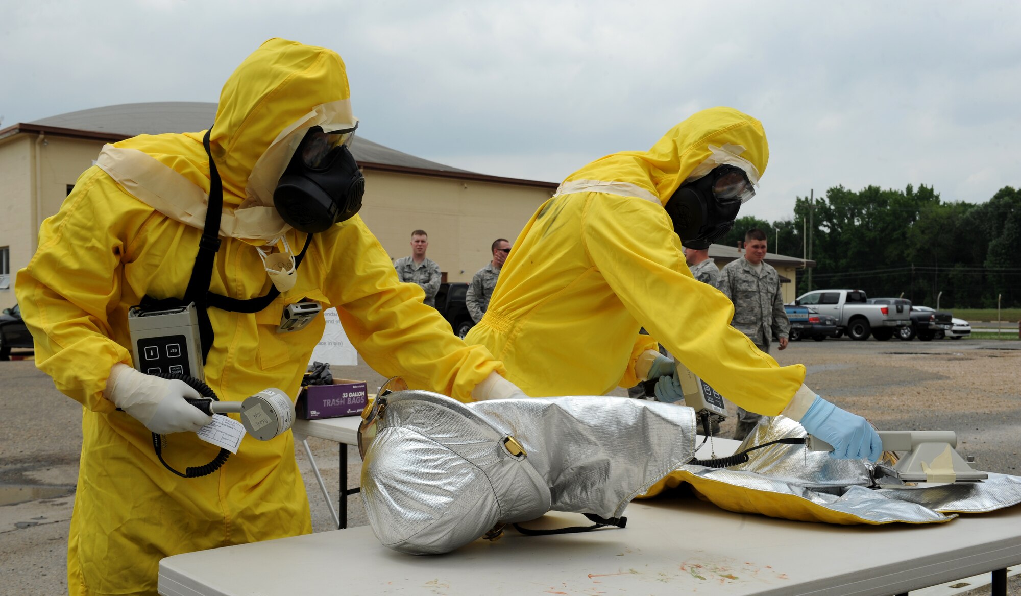 Airmen from the 2nd Civil Engineer Squadron emergency management check equipment for radiation contamination during a joint exercise on Barksdale Air Force Base, La., May 17, 2013. During the decontamination process, personnel and equipment are thoroughly checked for any contamination. (U.S. Air Force photo/Airman 1st Class Benjamin Gonsier)