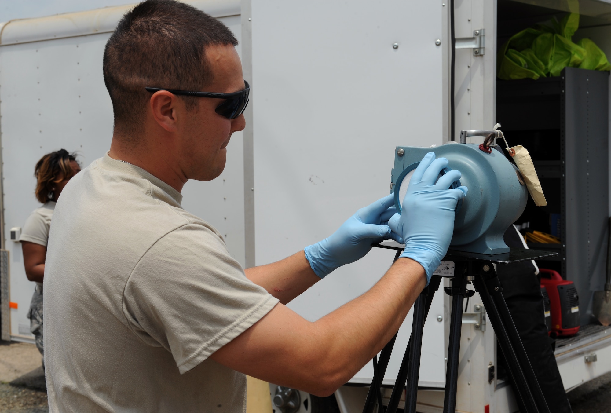 Staff Sgt. Shawn Gallagher, 2nd Aerospace Medicine Squadron bioenvironmental, sets up a radeco machine during a joint exercise on Barksdale Air Force Base, La., May 17, 2013. The radeco machine samples the air for airborne radiation. Bioenvironmental Airmen survey the filters on the machine to check the contamination levels. (U.S. Air Force photo/Airman 1st Class Benjamin Gonsier)
