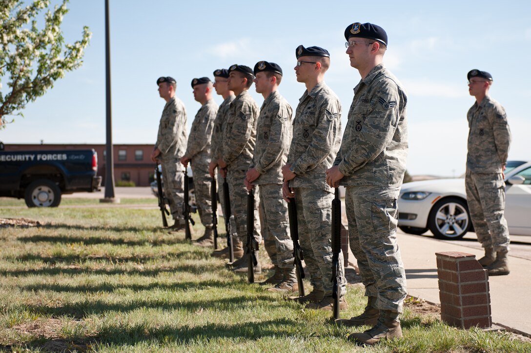 The 28th Security Forces Squadron firing party stands at ease during the Police Week retreat ceremony on Ellsworth Air Force Base, S.D., May 15, 2013. Peace Officers Memorial Day, a holiday created by former President John F. Kennedy, is recognized on May 15 every year. (U.S. Air Force photo by Airman 1st Class Alystria Maurer/Released)
