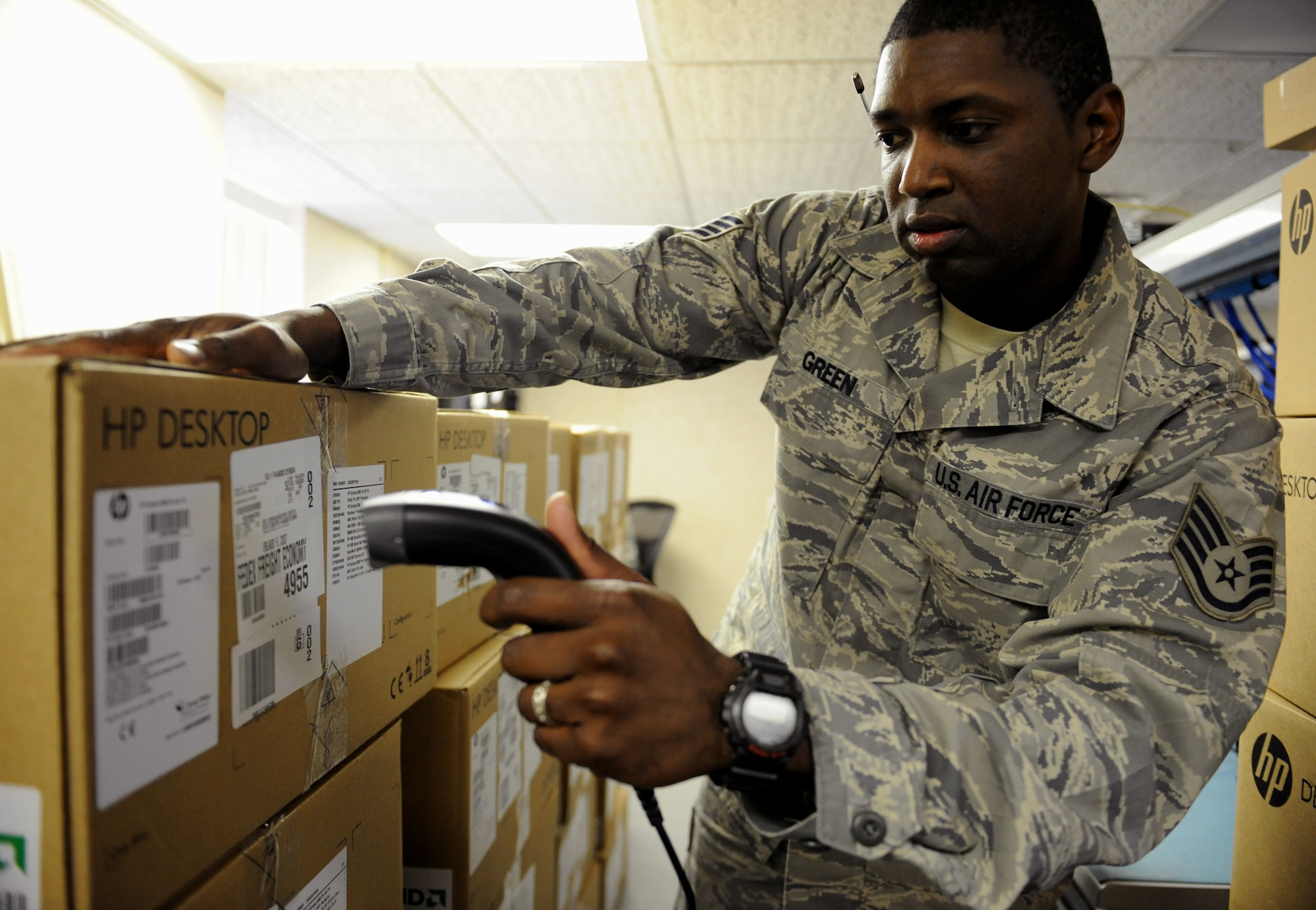 Staff Sgt. Gregory Green, 2nd Communications Squadron client service center, scans a package on Barksdale Air Force Base, La., May 21, 2013. When new equipment is processed, the CSC will take accountability and begin to reformat and install all the necessary programs a system may need. (U.S. Air Force photo/Airman 1st Class Benjamin Gonsier)