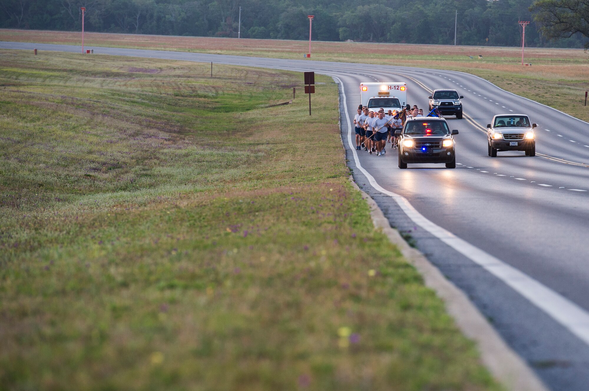 U.S. Air Force members past and present from the 9th Special Operations Squadron and 1st Special Operations Maintenance Squadron run both guidons from Eglin Air Force base, to Hurlburt Field, Fla., May 20, 2013. The units are moving to Hurlburt Field after been stationed on Eglin for more than 20 years.  (U.S. Air Force photo/Airman 1st Class Christopher Callaway) 