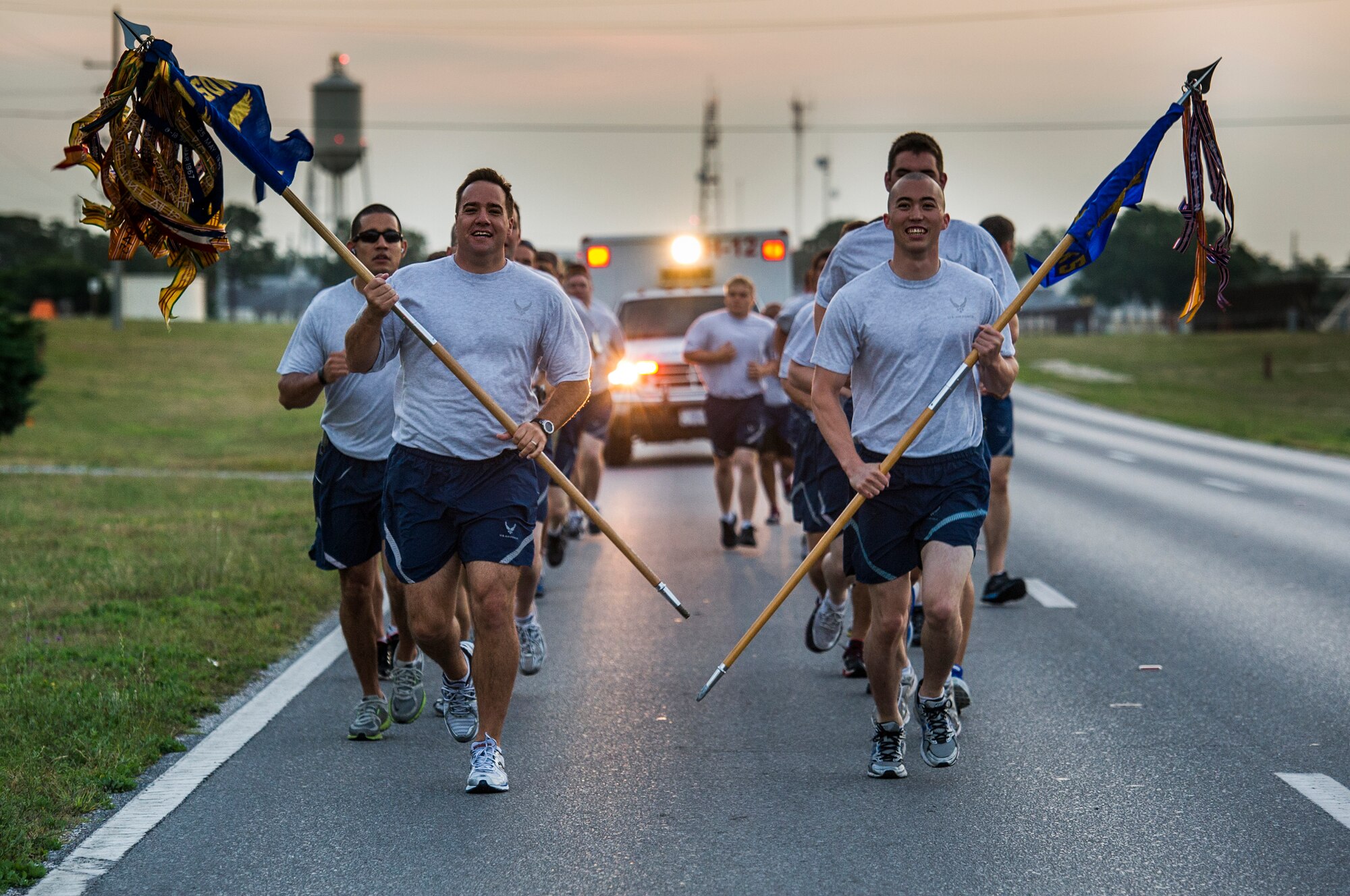U.S. Air Force members past and present from the 9th Special Operations Squadron and 1st Special Operations Maintenance Squadron run both guidons from Eglin Air Force Base to Hurlburt Field, Fla., May 20, 2013. The units are moving to Hurlburt Field after been stationed on Eglin for more than 20 years.  (U.S. Air Force photo/Airman 1st Class Christopher Callaway) 