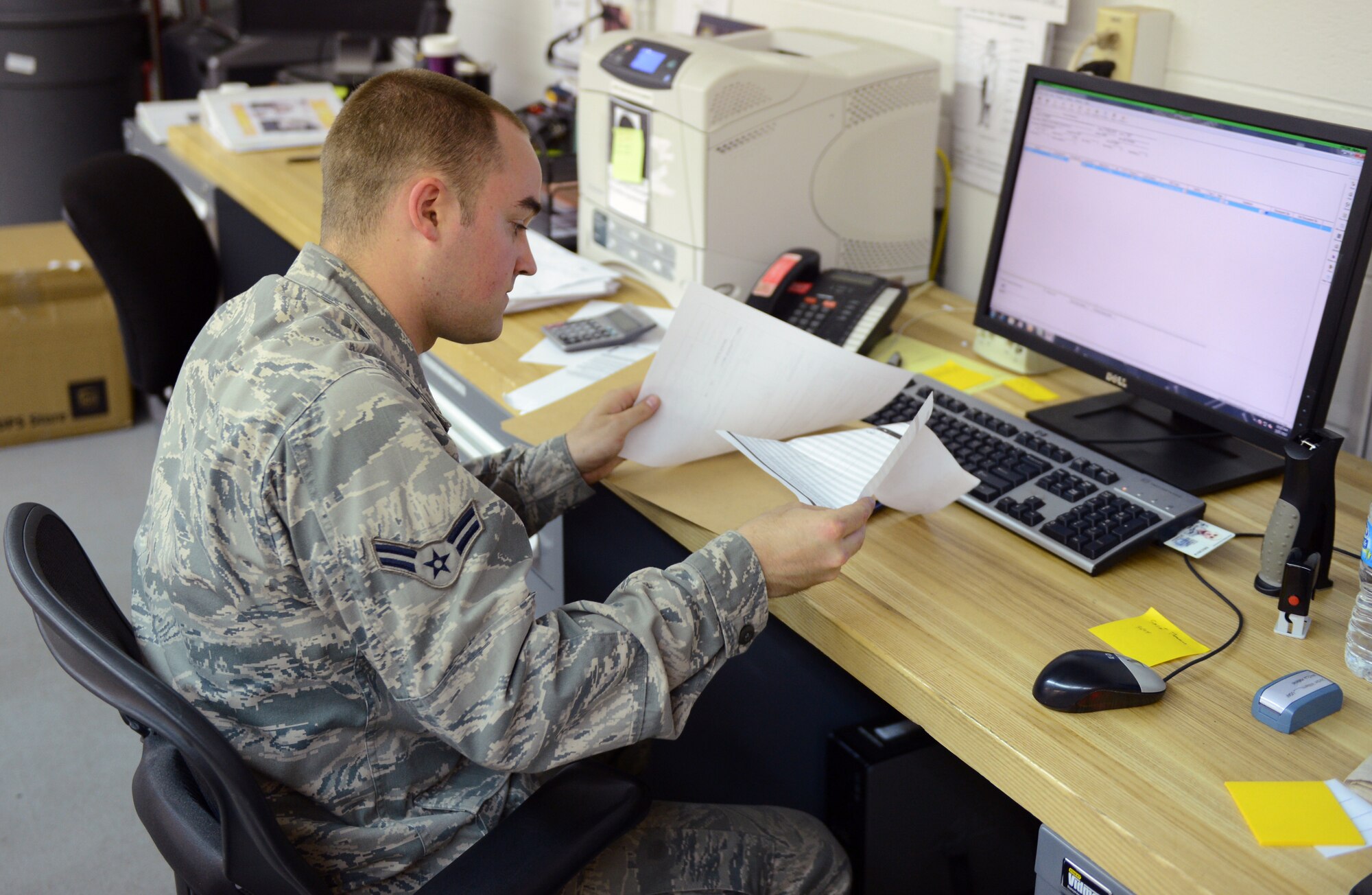 Airman 1st Class Jordan Williams, 2nd Medical Support Squadron Medical Logistics, logs items received on Barksdale Air Force Base, La., May 21, 2013. Incoming and outgoing Items are logged into the computer so they can be tracked and delivered to the appropriate source. (U.S. Air Force photo/Senior Airman Micaiah Anthony)