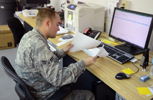 Airman 1st Class Jordan Williams, 2nd Medical Support Squadron Medical Logistics, logs items received on Barksdale Air Force Base, La., May 21, 2013. Incoming and outgoing Items are logged into the computer so they can be tracked and delivered to the appropriate source. (U.S. Air Force photo/Senior Airman Micaiah Anthony)