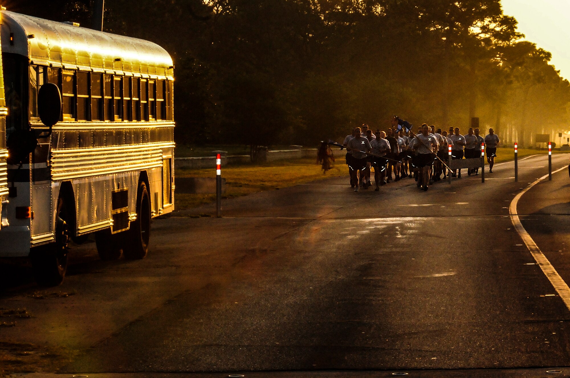 U.S. Air Force members past and present from the 9th Special Operations Squadron and 1st Special Operations Maintenance Squadron run both guidons from Eglin Air Force base to Hurlburt Field, Fla., May 20, 2013. The units are moving to Hurlburt Field after been stationed on Eglin for more than 20 years.  (U.S. Air Force photo/Airman 1st Class Christopher Callaway) 