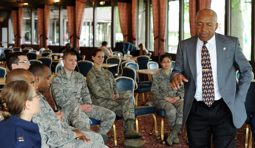 U.S. Air Force Col. (Ret) Norman A. McDaniel speaks to members of the Company Grade Officers Club during a meeting at Joint Base Andrews, Md., May 21, 2013. Norman became a Prisoner of War after his plane was shot down in North Vietnam in 1966. (U.S. Air Force photo/Staff Sgt. Nichelle Anderson)