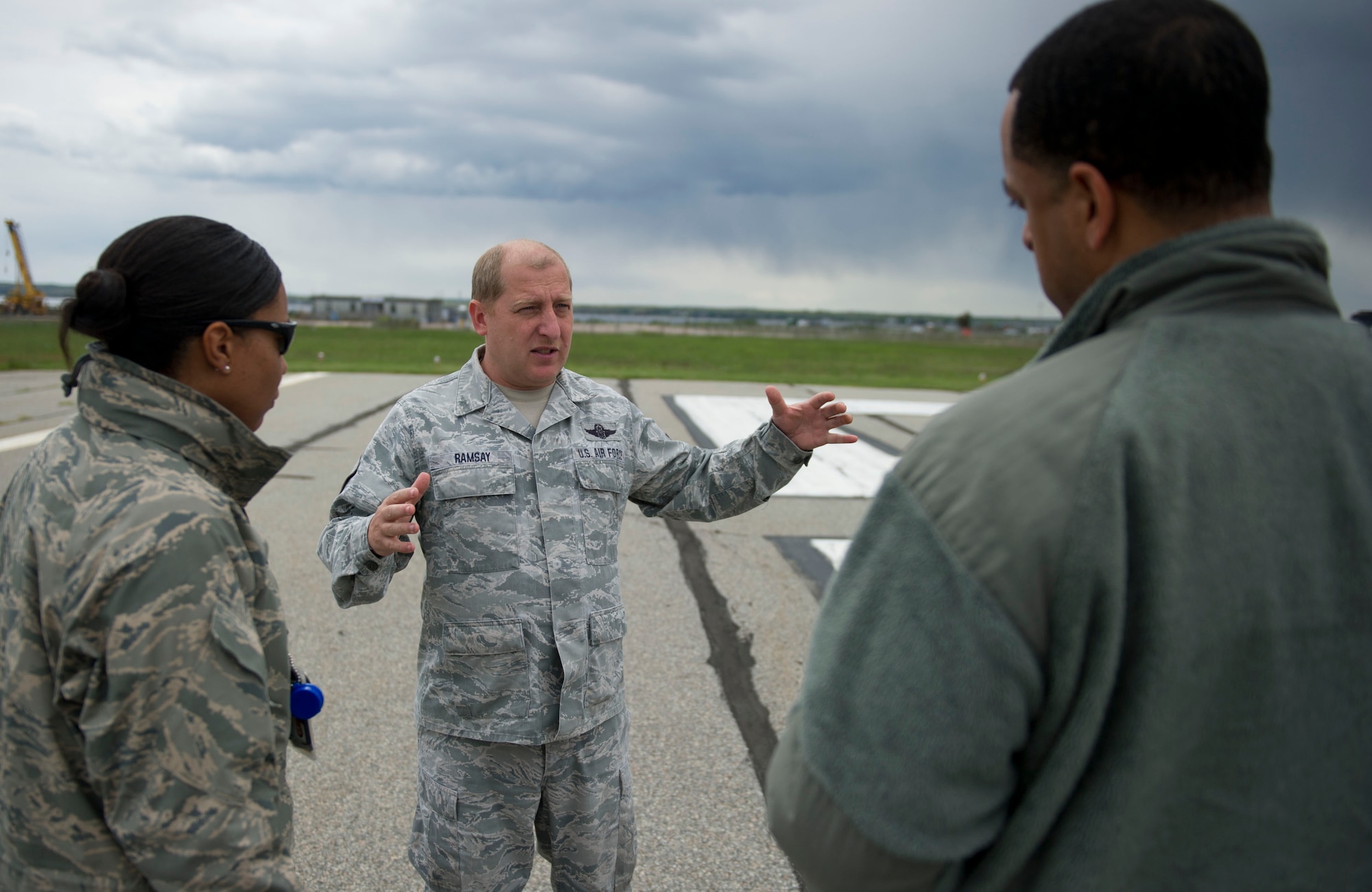 QUONSET POINT AIR NATIONAL GUARD STATION, R.I. -- Master Sgt. Harold Ramsay, 143rd Airlift Wing deputy airfield manager, speaks to members of the 818th Contingency Response Group during the 818 CRG-143 AW exercise at Quonset Point Air National Guard Station, RI, May 14, 2012. The training included C-130 Hercules operations, static loading/unloading, day and night engine running on-load/offload, night vision gear engine running on-load/offload, combat offloads, airdrop rigging, maintenance familiarization, drop zone recovery training, night vision gear marshaling training, full spectrum communications, and integrated command and control with the 143rd AW operations. (U.S. Air Force photo by Staff Sgt. Gustavo Gonzalez) 