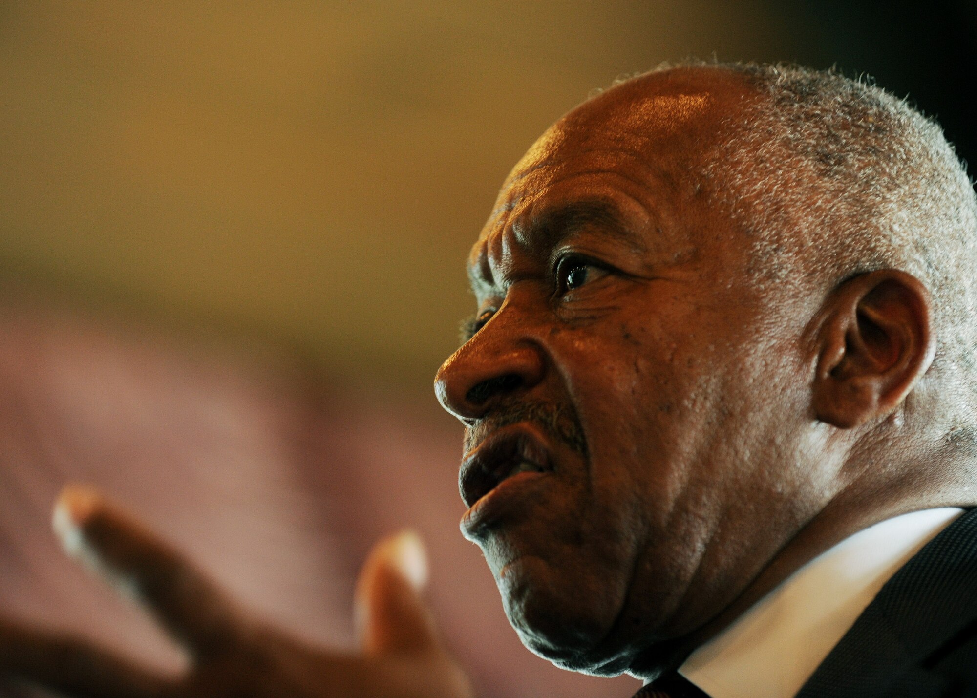 U.S. Air Force Col. (Ret) Norman A. McDaniel speaks to members of the Company Grade Officers Club during a meeting at Joint Base Andrews, Md., May 21, 2013. Norman became a Prisoner of War after his plane was shot down in North Vietnam in 1966. (U.S. Air Force photo/Staff Sgt. Nichelle Anderson)