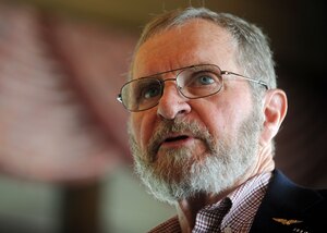James H. Warner speaks to memebrs of the Joint Base Andrews Company Grade Officer Club, during a meeting at the Course at Andrews, May 21, 2013. Warner, a former United States Marine Corps Captain spent five years and five months as a prisoner of war after his F-4B Phantom was shot down in North Vietnam.
(U.S. Air Force photo/Staff Sgt. Nichelle Anderson)