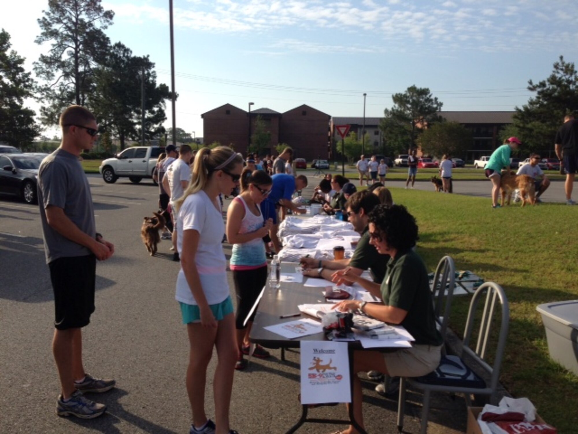 Members of Team Moody and the local community register for the 5K-9 Fun Run and Walk at Moody Air Force Base, Ga., to benefit an animal rescue shelter run by the Humane Society May 18, 2013. Proceeds from the 5K raised more than $5,000 to benefit the Humane Society, which helps provide low cost spaying and neutering for cats and dogs. (Courtesy photo)  