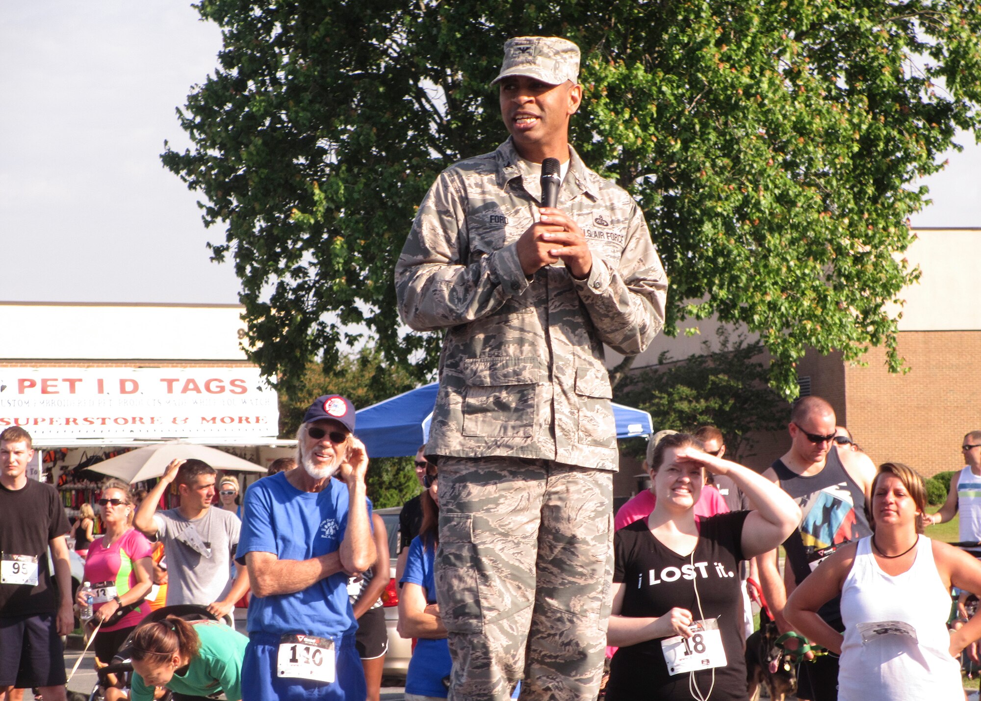 U.S. Air Force Col. Edward Ford, 23d Mission Support Group commander, makes opening remarks prior to the 5K-9 Fun Run and Walk at Moody Air Force Base, Ga., May 18, 2013. The proceeds from the 5K helped raise more than $5,000 toward the Humane Society, and the adoption fair helped find homes for almost every animal. (U.S. Air Force photo by Senior Airman Eileen Meier/Released)