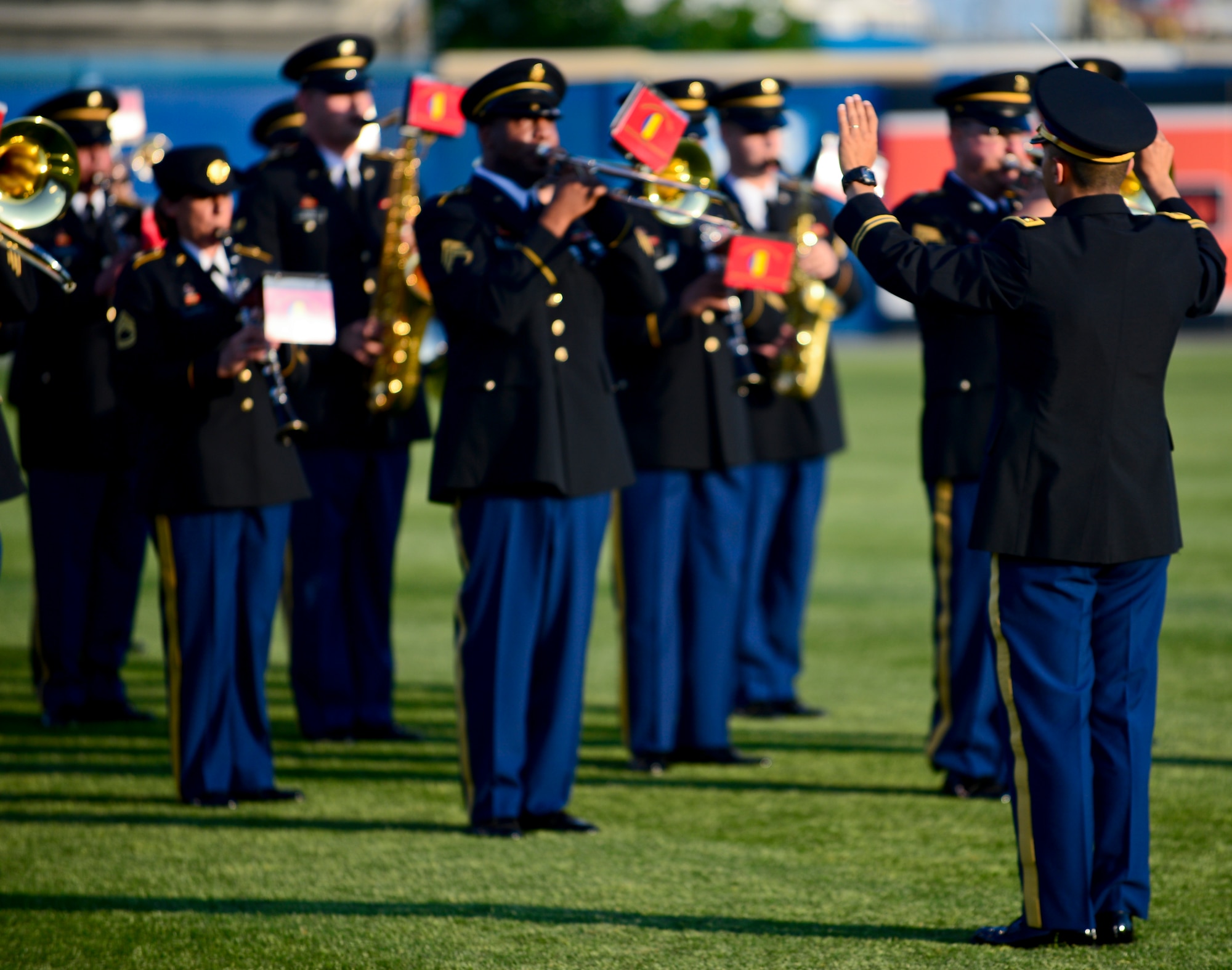 The U.S. Army Training and Doctrine Command Band participate in Armed Forces Night at the Norfolk Tides baseball game at Harbor Park in Norfolk, Va., May 17, 2013. The TRADOC band performed a medley of each service’s official song, followed by the national anthem. (U.S. Air Force photo by Senior Airman Kayla Newman/Released)