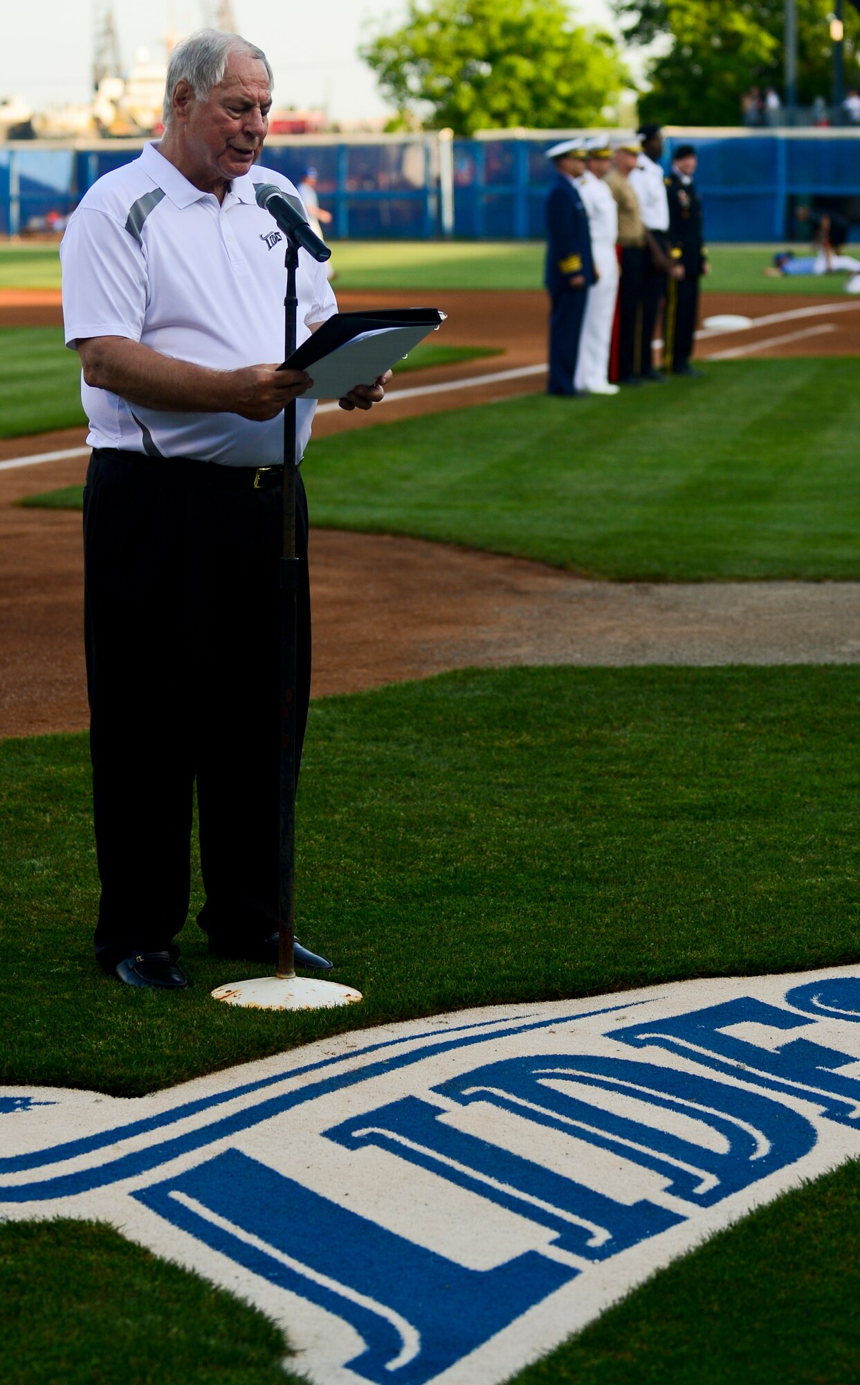 The narrator for the Norfolk Tides introduces the senior military representatives from each branch of service during the Norfolk Tides Armed Forces Night at Harbor Park in Norfolk, Va., May 17, 2013.  The Tides paid tribute to the men and women of the U.S. Army, Air Force, Coast Guard and Marines for their dedication and service to the nation. (U.S. Air Force photo by Senior Airman Kayla Newman/Released)