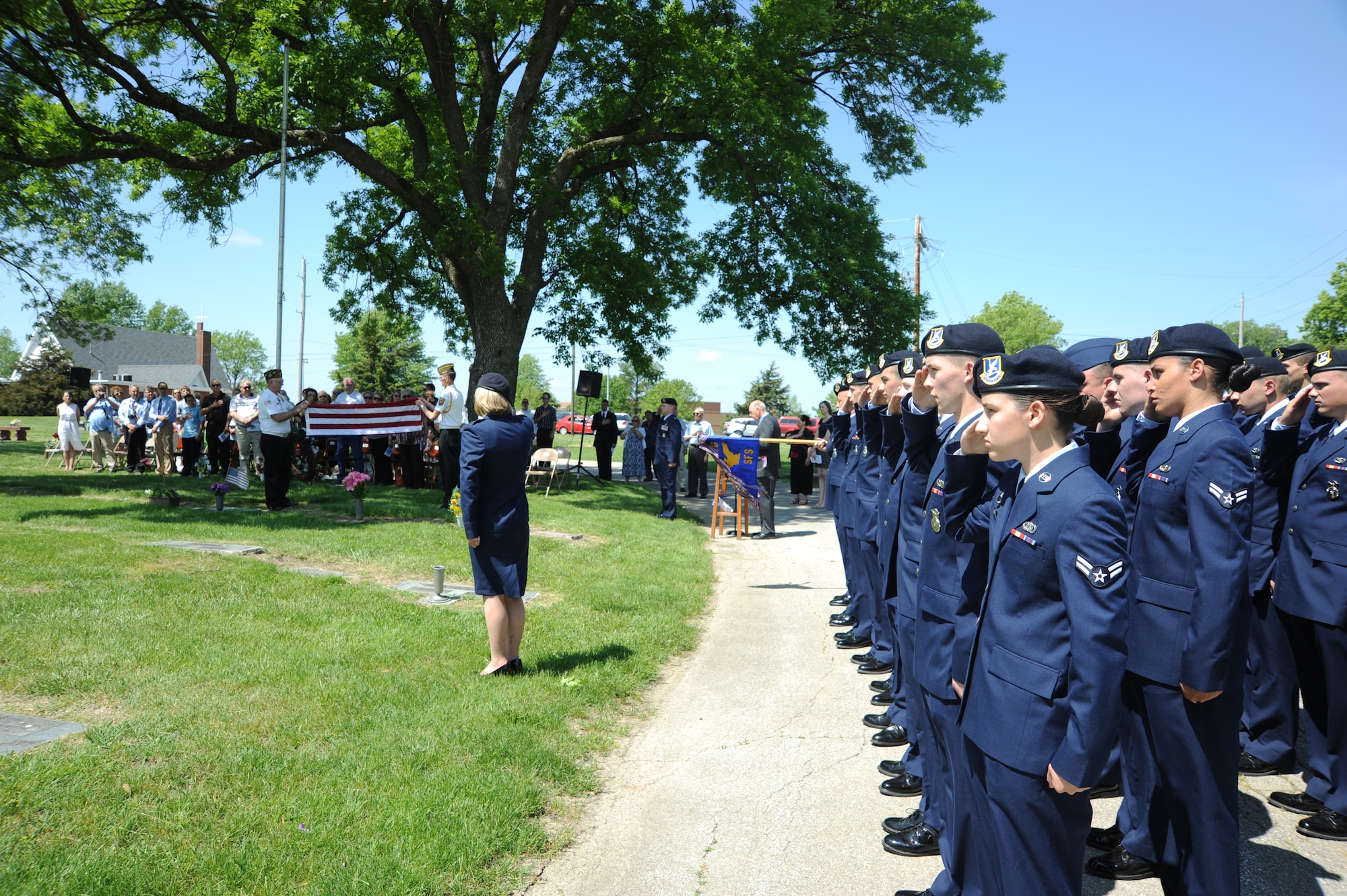 The 509th Security Forces Squadron from Whiteman Air Force Base, Mo., pays respects to 2nd Lt. George Whiteman during the 25th annual wreath-laying ceremony May 18, 2013, in Sedalia, Mo. The 509th SFS and Sedalia are “sister cities” who help each other during community events which support Airmen.  (U.S. Air Force photo by Senior Airman Brigitte N. Brantley/Released)