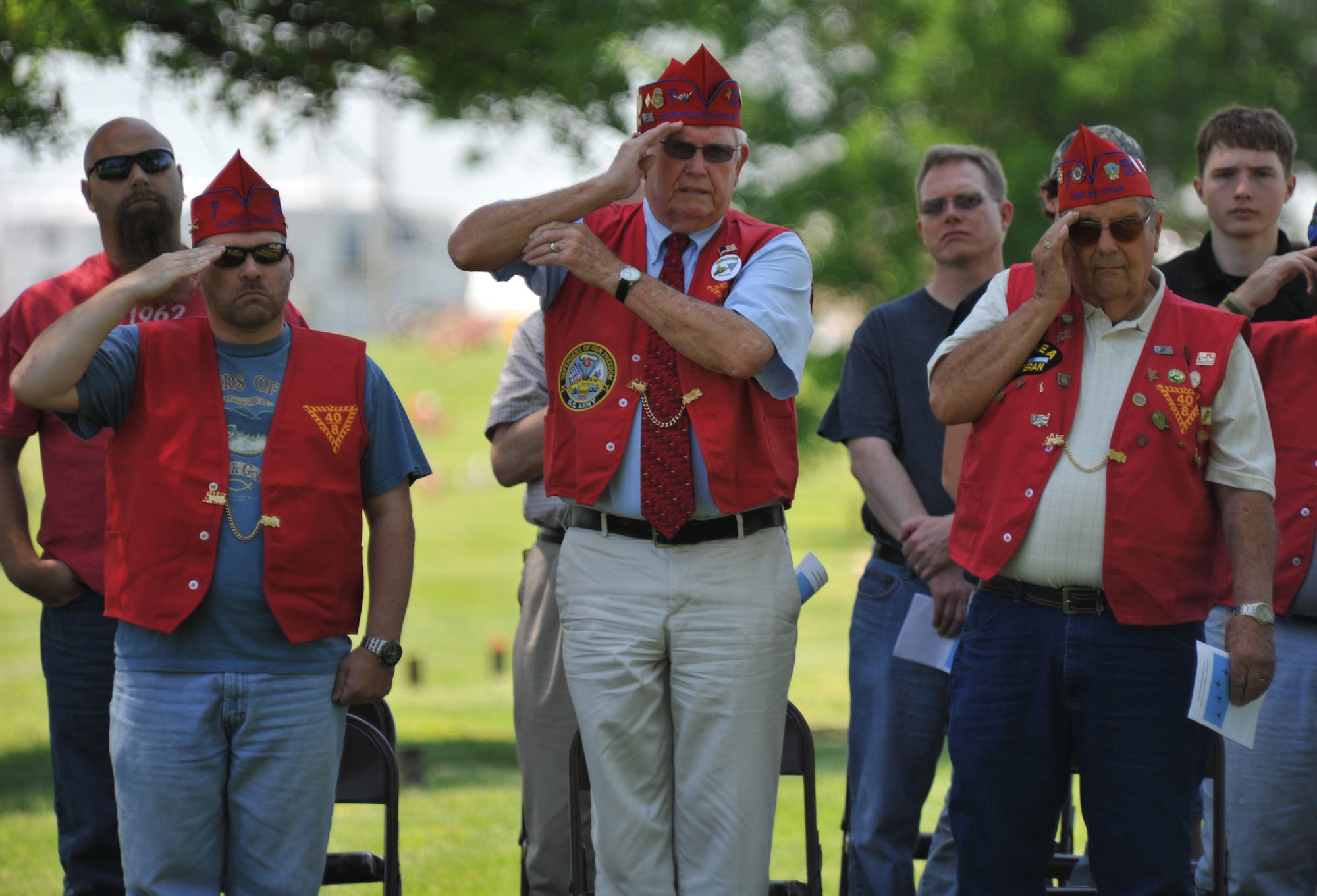 Members from the local Veterans of Foreign Wars chapter salute while the flag is raised during a wreath-laying ceremony for 2nd Lt. George Whiteman May 18, 2013, in Sedalia, Mo. Whiteman, a Sedalia native, was one of the first Airmen to die during World War II when the Japanese attacked Pearl Harbor.  (U.S. Air Force photo by Senior Airman Brigitte N. Brantley/Released)