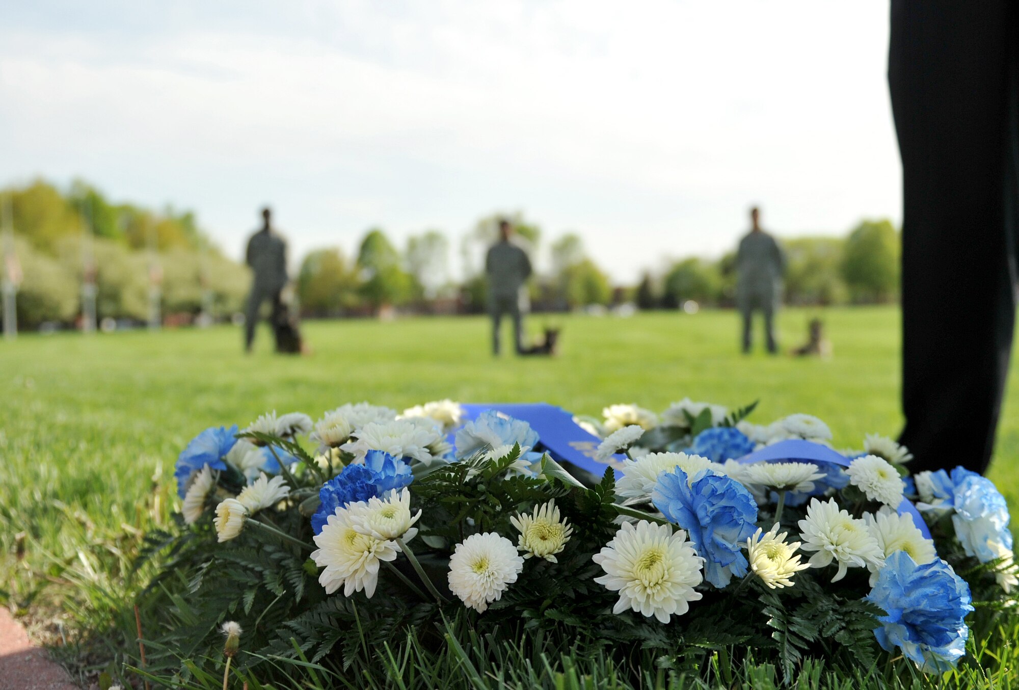 A wreath is laid on the Offutt Parade Grounds during a retreat ceremony for Police Week at Offutt Air Force Base, Neb. May 16. The wreath is traditionally presented before guests, paying tribute to law enforcement officers who were lost in the line of duty. (U.S. Air Force photo by Jeff W. Gates/Released)