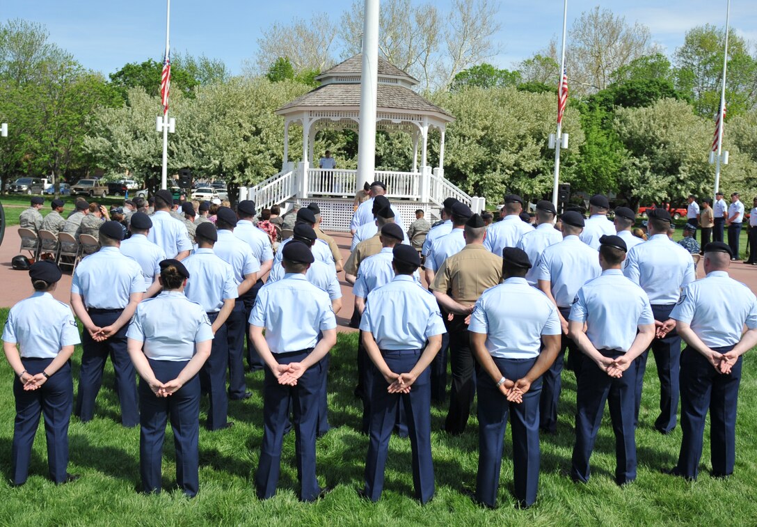 Members of the 55th Security Forces Squadron stand at parade rest during the Police Week Retreat Ceremony at the Offutt Parade Grounds on May 16. (U.S. Air Force photo by Jeff W. Gates/Released)