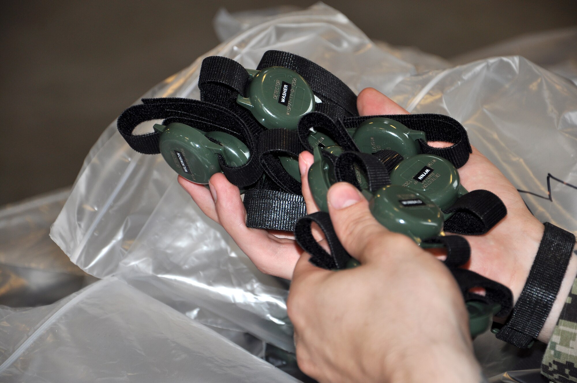 Radiation detectors are handed out for an exercise at Fort Eustis, Va. May 21, 2013. The exercise, known as Exercise Sudden Response 13, will take place from May 20-24, and tests the movement and capablity of JTF-CS’s equipment and personnel during the initial phases of a chemical, biological or nuclear incident. (U.S. Air Force photo by Tech. Sgt. April Wickes/Released)