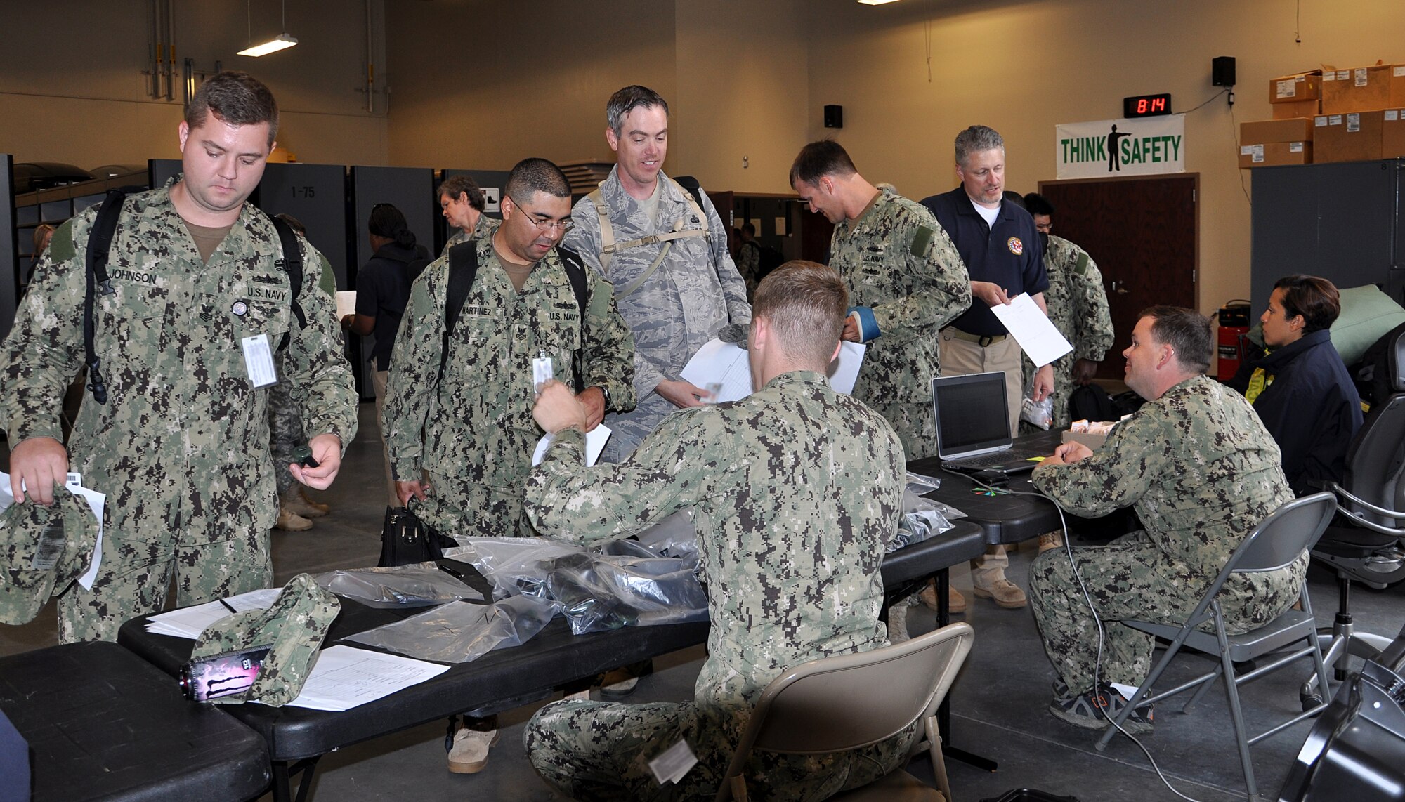 Joint Task Force Civil Support personnel receive radiation detectors and simulated medications for an exercise at Fort Eustis, Va. May 21, 2013. The exercise, known as Exercise Sudden Response 13, will take place from May 20-24, and tests the movement and capablity of JTF-CS’s equipment and personnel during the initial phases of a chemical, biological or nuclear incident. (U.S. Air Force photo by Tech. Sgt. April Wickes/Released)