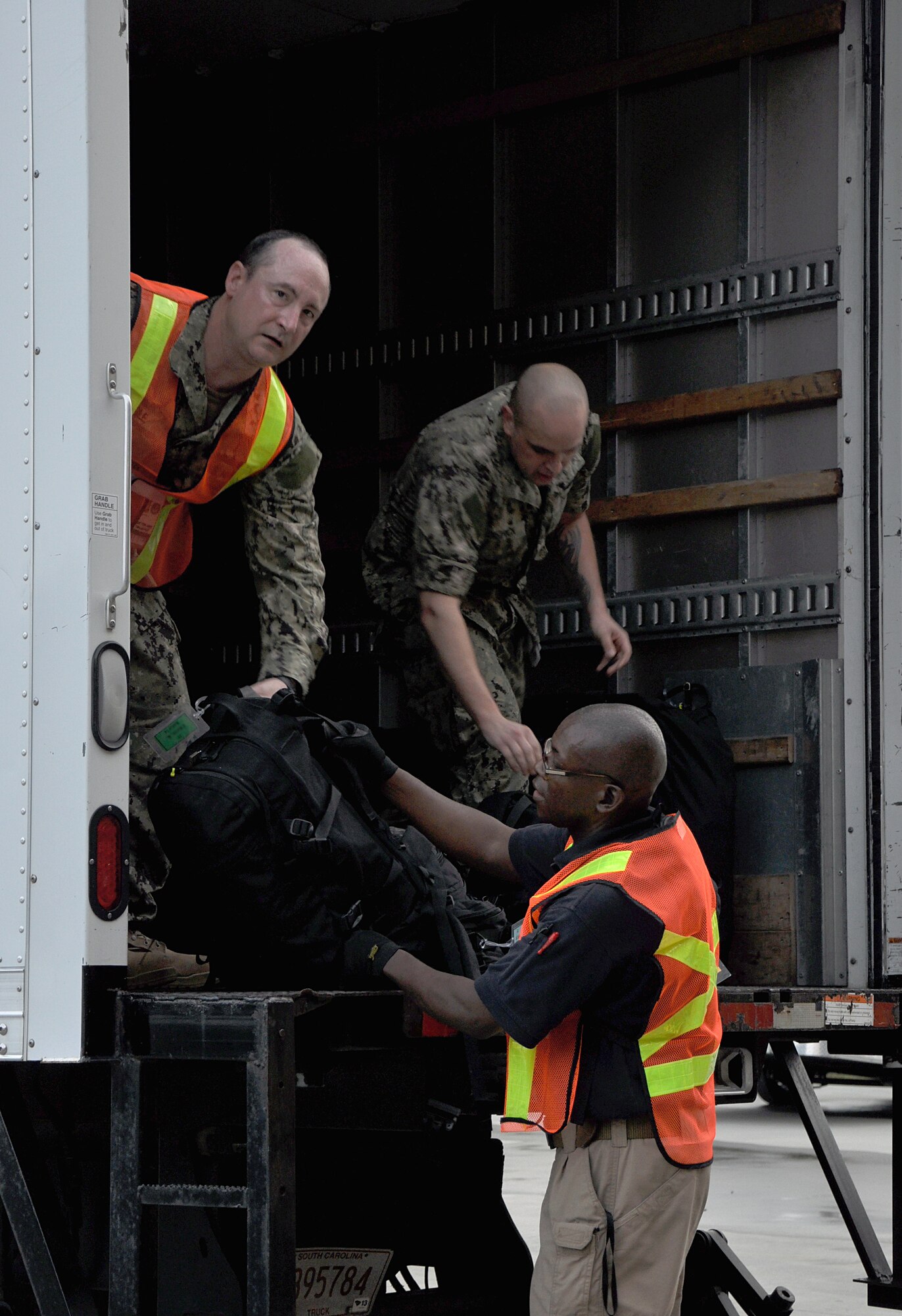 Joint Task Force Civil Support personnel load cargo during an exercise at Fort Eustis, Va., May 21, 2013. The exercise, known as Exercise Sudden Response 13, will take place from May 20-24, and tests the movement and capablity of JTF-CS’s equipment and personnel during the initial phases of a chemical, biological or nuclear incident. (U.S. Air Force photo by Tech. Sgt. April Wickes/Released)