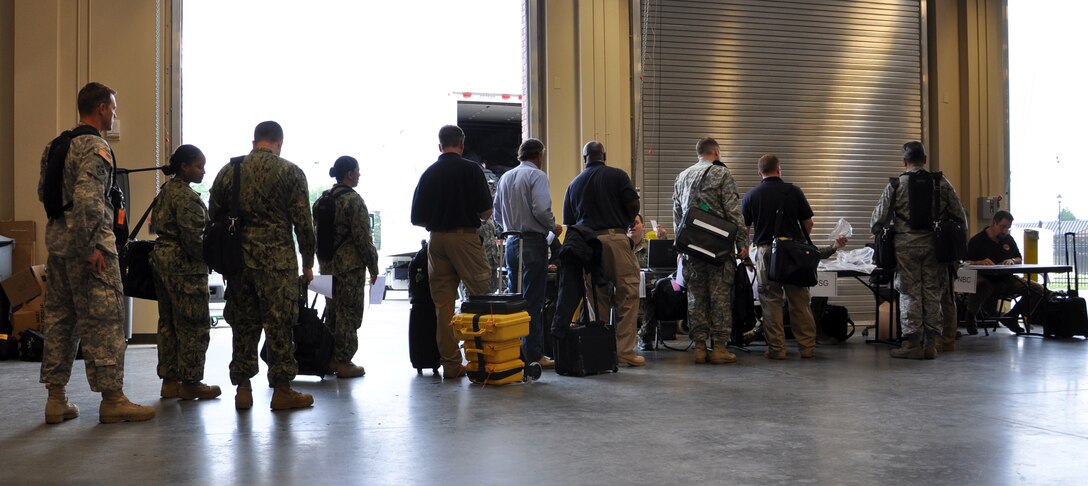 Joint Task Force Civil Support personnel outprocess during an exercise at Fort Eustis, Va., May 21, 2013. The exercise, known as Exercise Sudden Response 13, will take place from May 20-24 and validates JTF-CS headquarters and command and control processes against a set timeline. (U.S. Air Force photo by Tech. Sgt. April Wickes/Released)