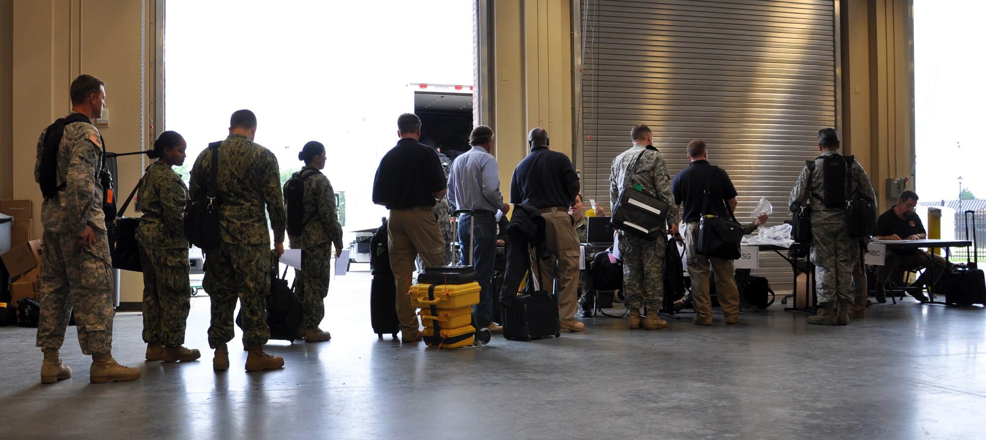 Joint Task Force Civil Support personnel outprocess during an exercise at Fort Eustis, Va., May 21, 2013. The exercise, known as Exercise Sudden Response 13, will take place from May 20-24 and validates JTF-CS headquarters and command and control processes against a set timeline. (U.S. Air Force photo by Tech. Sgt. April Wickes/Released)