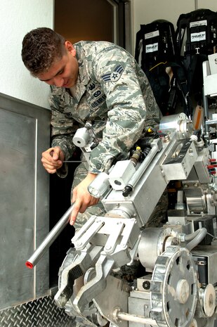 Senior Airman Kristin Ponce, 99th Civil Engineer Squadron explosive ordinance disposal technician, prepares a Remotec Andros F-6 robot to investigate a suspicious package as part of an exercise May 16, 2013, at Nellis Air Force Base, Nev. The robot allows EOD technicians in a remote location to investigate and neutralize potential threats using multiple actuators and a video camera. (U.S. Air Force photo by Staff Sgt. Gregory Brook)