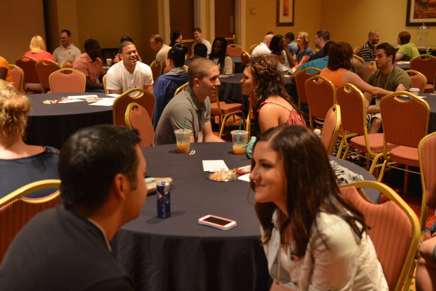 Couples pair up with their spouse and participate in a communication exercise during a marriage retreat, Charleston, S.C., May 18, 2013. The retreat was held to strengthen the bond of the couples and help enhance their marriage. (U.S. Air Force photo by Airman 1st Class Ashley L. Gardner/Released)