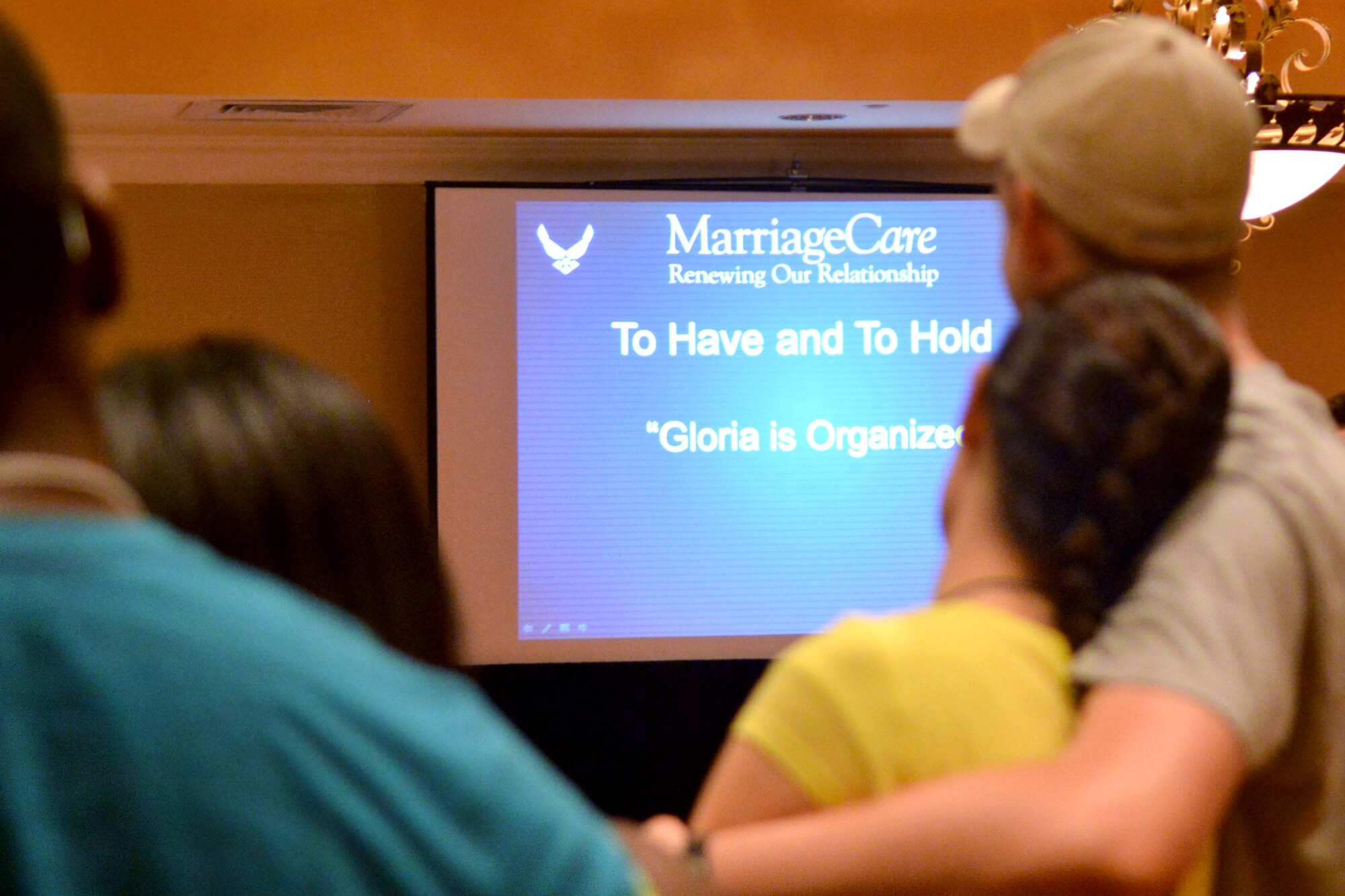 A couple holds each other during a marriage retreat offered by the Shaw Air Force Base Chapel team, Charleston, S.C., May 18, 2013. The retreat was held to strengthen the bond of the couples and help enhance their marriage. (U.S. Air Force photo by Airman 1st Class Ashley L. Gardner/Released)