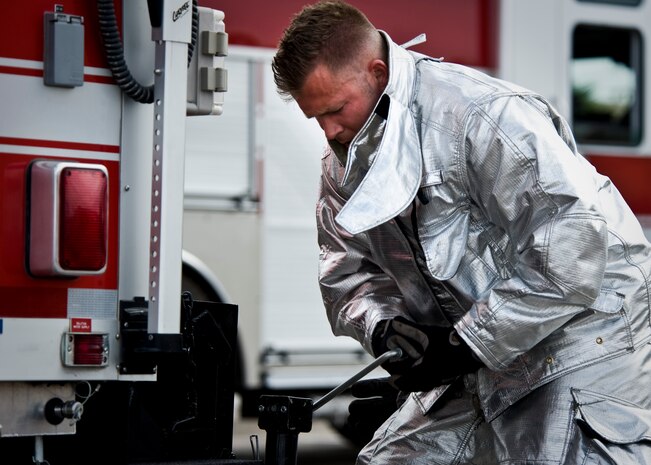 Staff Sgt. Daniel Meginness, 99th Civil Engineer Squadron firefighter, sets up the decontamination trailer during an exercise May 16, 2013, at Nellis Air Force Base, Nev. The exercise was conducted to test Airmen’s readiness to prepare for real world scenarios. (U.S. Air Force Photo by Airman 1st Class Jason Couillard)