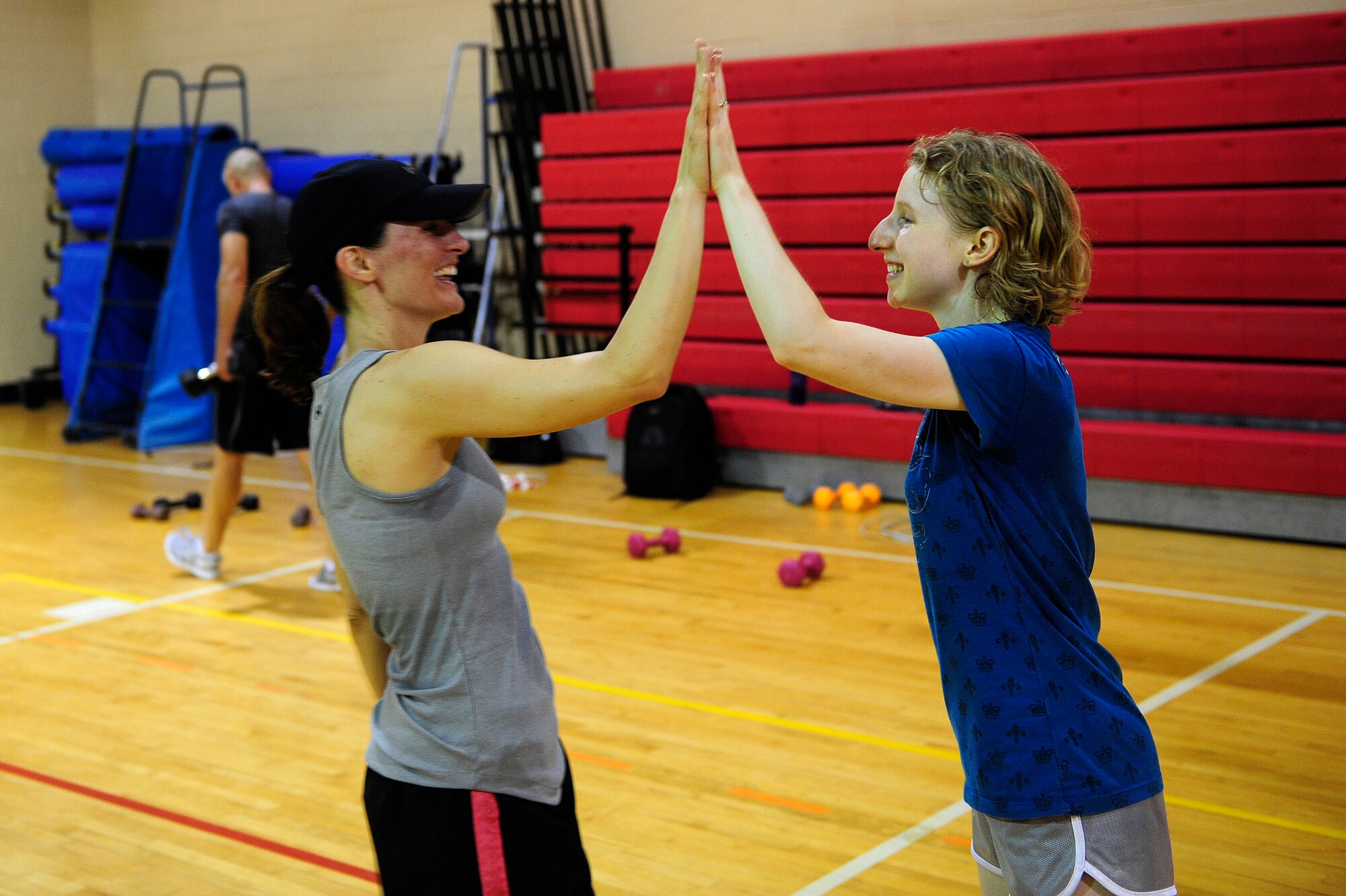 Team Shaw members, and Fit Max participants, congratulate each other after their 40-minute workout session at Shaw Air Force Base, S.C., May 20, 2013. This course is an interval-based strength and cardio training program offered through the fitness center. Fitness center staff offer more information about this class and others.  (U.S. Air Force photo by Airman 1st Class Daniel Blackwell/Released)