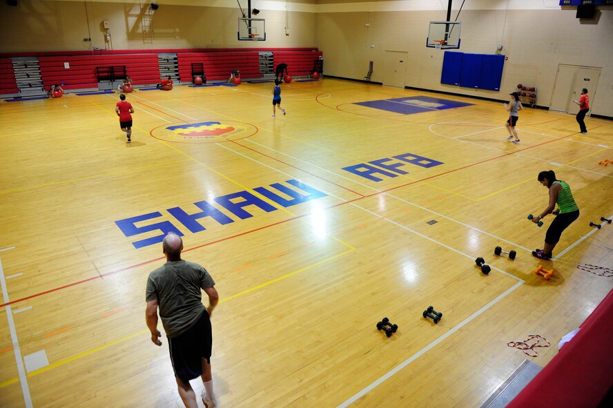 Participants of the Fit Max program, run back and forth between assigned stations as they work out at Shaw Air Force Base, S.C., May 20, 2013. The Fit Max course at the fitness center, is an interval-based training program designed to build both strength and cardio endurance. (U.S. Air Force photo by Airman 1st Class Daniel Blackwell/Released)