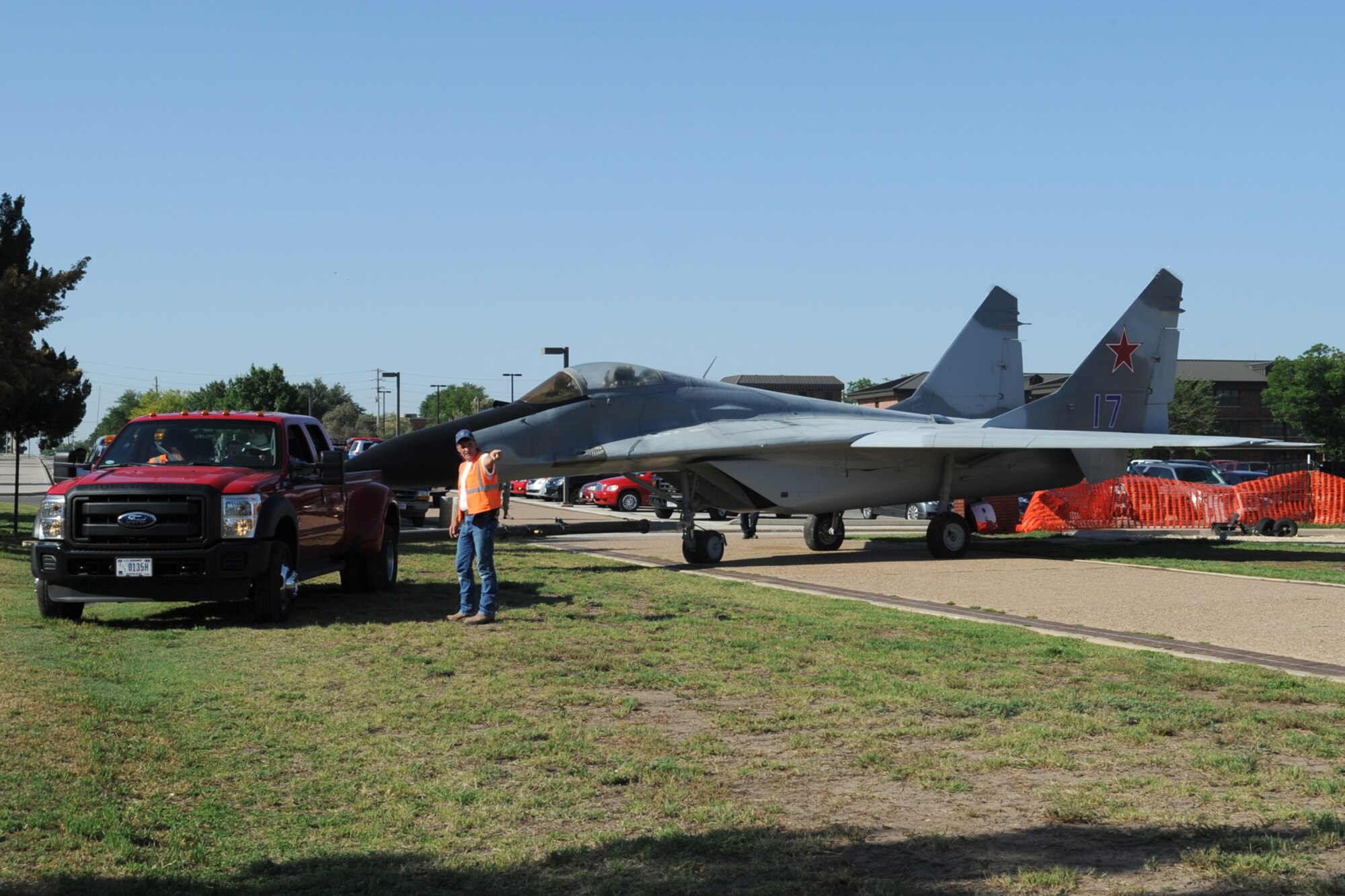 GOODFELLOW AIR FORCE BASE, Texas-17th Civil Engineer, Tommy Kirk, 17th Civil Engineering Squadron, directs movement of a MiG-29 Fulcrum A configuration trainer on Goodfellow Air Force Base, May 17. Goodfellow moved the aircraft to accommodate construction of a new intelligence training facility for the Royal Saudi Air Force. (U.S. Air Force photo by Staff Sgt. Laura R. McFarlane) 