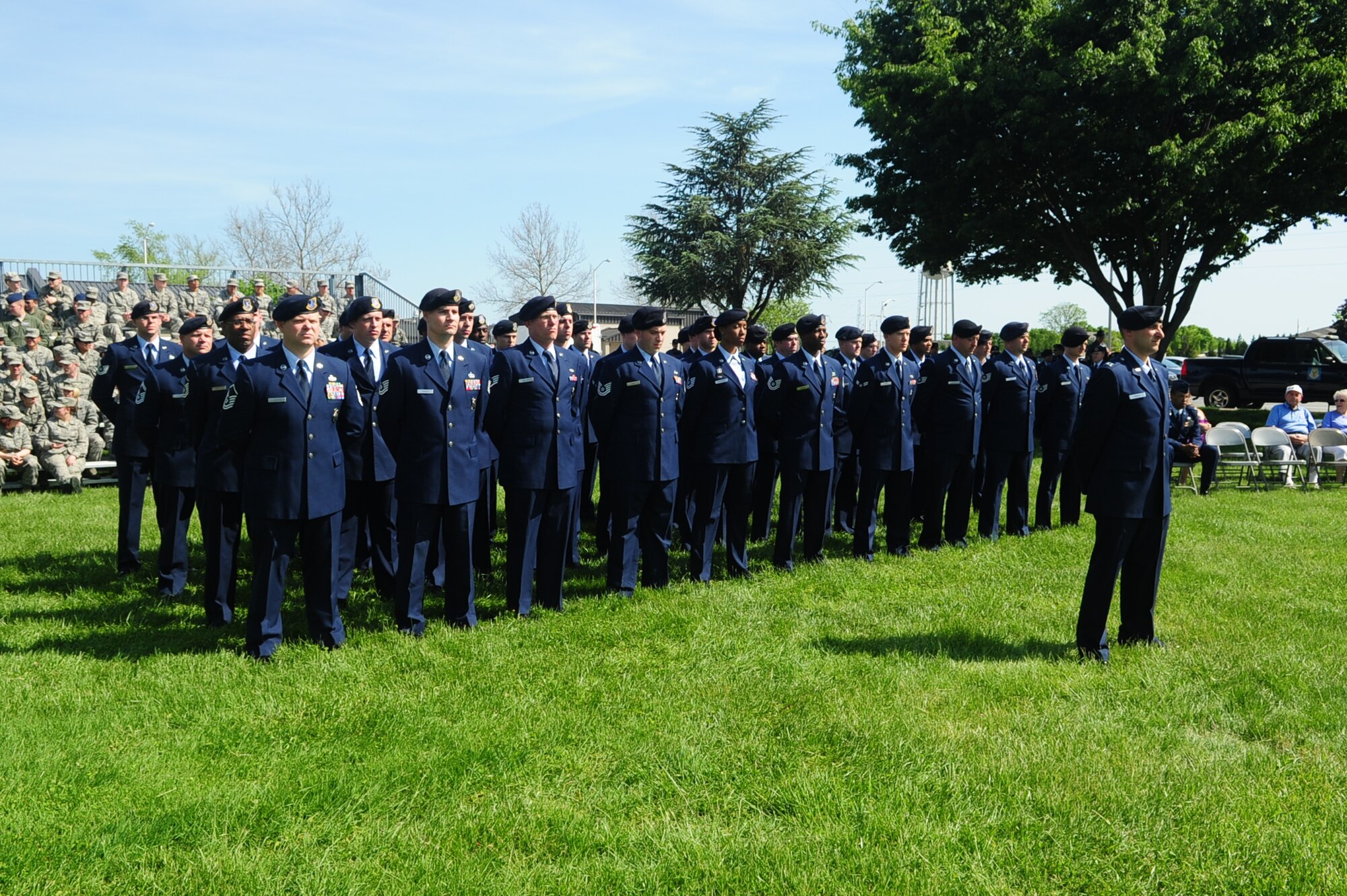 Members of the 436th Security Forces Squadron stand in formation during a
retreat ceremony May 17, 2013 at the 436th Airlift Wing headquarters
building on Dover Air Force Base, Del. The retreat ceremony was part of the
436th SFS celebration of National Police Week. (U.S. Air Force photo/Airman
1st Class Ashlin Federick)
