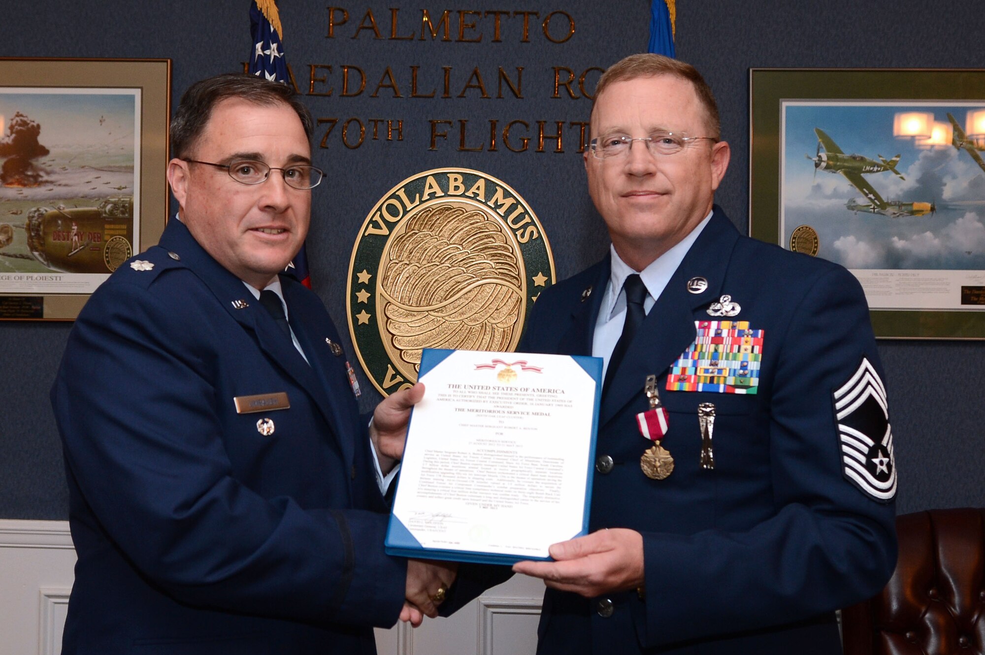 U.S. Air Force Chief Master Sgt. Robert Benton retires after more than 30 years of military service at Shaw Air Force Base, S.C., May 16, 2013.  Benton originally enlisted in the U.S. Army in June 1982, and  three years later enlisted in the Air Force. Throughout his career, he provided deployment support for Operation Desert Shield/Desert Storm, Operation Provide Promise, Operation Southern watch and Operation Iraqi Freedom/New Dawn. (U.S. Air Force photo by Airman 1st Class Nicole Sikorski/Released)