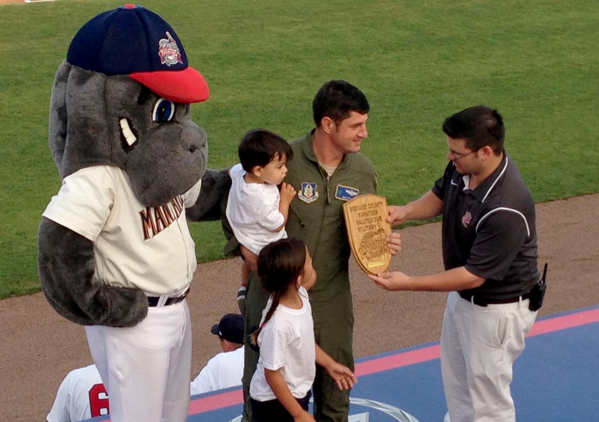 With a Bronze Star and 9 Air Medals for heroics behind the yoke of a chopper, Maj. Rod Stout, Air Force Reserve rescue pilot, 920th Rescue Wing, Patrick Air Force Base, Fla., landed on the field of a Florida minor league baseball game May 16, to be honored by his home team, the Brevard County Manatees. (Courtesy photo)