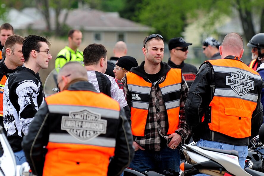U.S. Air Force Tech. Sgt. David Luce, a diagnostic imaging floor manager with the 55th Medical Group, talks with other motorcycle riders while he waits for the 2013 55th Wing Mentorship Ride to begin May 10 at Offutt Air Force Base, Neb. More than 100 riders participated in the event that provided hands-on experience riding in groups over a span of 134 miles. Group riding is known to be an effective way to influence new riders on using safe practices.  (U.S. Air Force photo by Josh Plueger/Released)