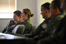U.K. Royal Air Force Sgt. Michelle Howden sits in a crew resource management briefing as part of her upgrade training on the RC-135 Rivet Joint aircraft, Offutt Air Force Base, Neb.  The overall training took a little more than two weeks to complete and took RAF Airmen through classroom training, the simulator as well as flying the latest version of the RJ.  (U.S. Air Force Photo by Josh Plueger/Released)